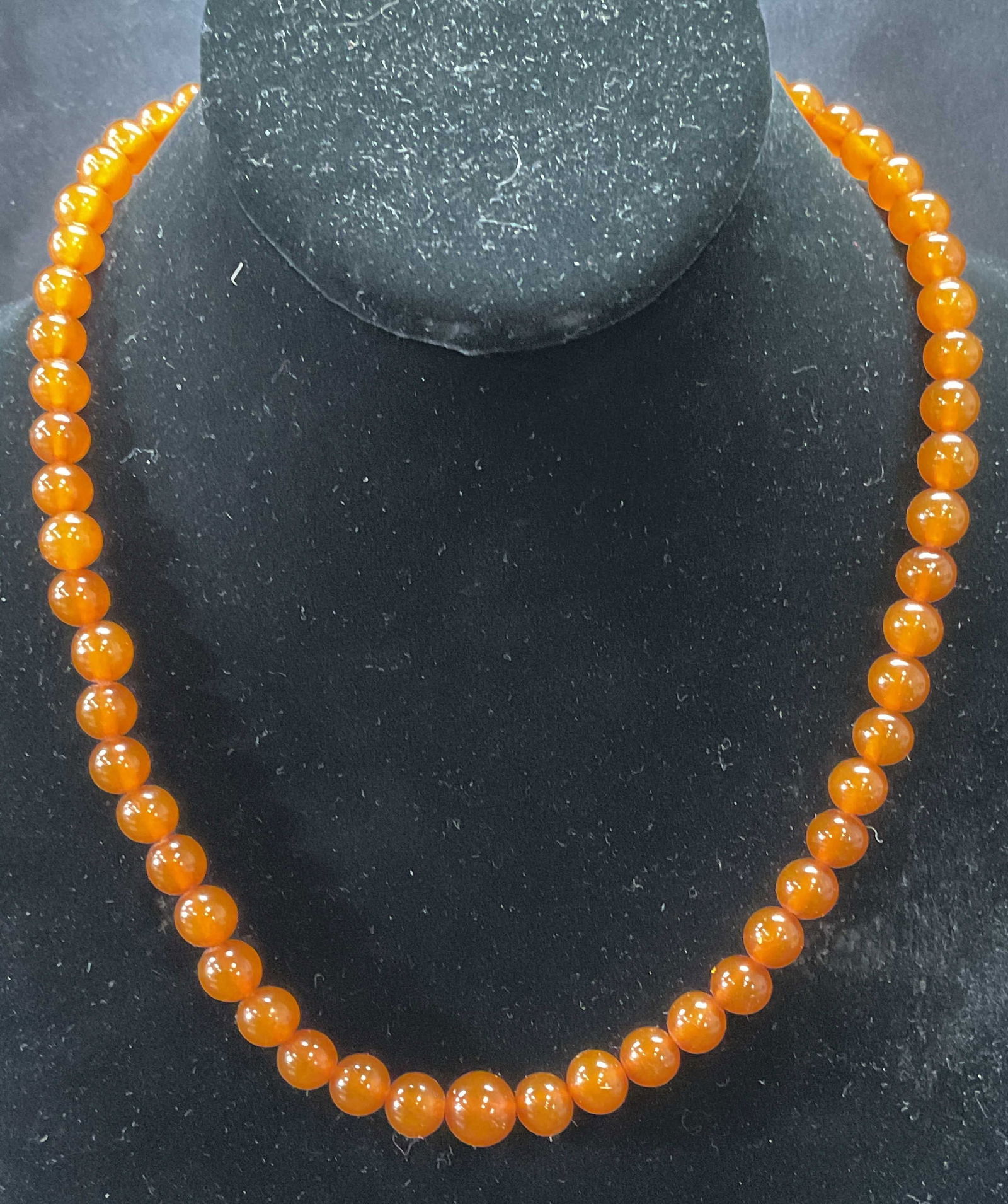 Vintage Amber Beaded Choker Necklace: Vintage Amber beaded choker necklace. Drop length approx. 8.5 inches. Amber fluoresces opaque pale green under UV light. Some surface wear including scratching observed. Jewelry, estate jewelry, fine