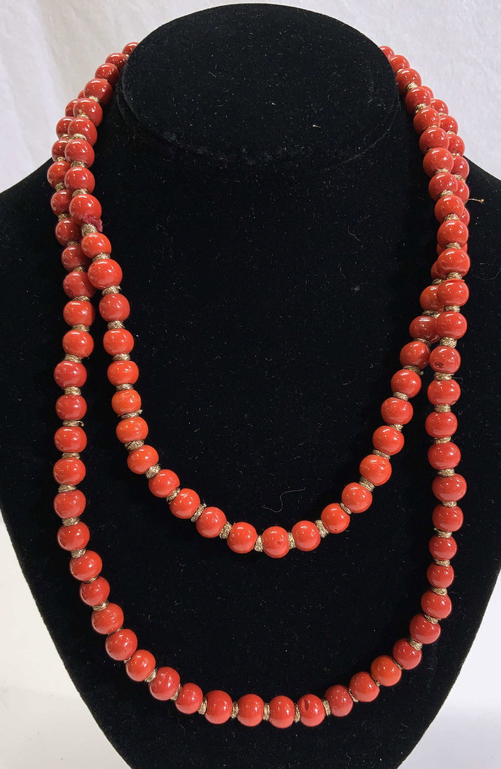 Opera Length Orange Coral Art Glass Necklace: Hand crafted faux coral art glass bead necklace. Round glass beads with gold tone wire wrapping on a flexible wire. A few beads have a chip to them. 17.5 in. Drop. orange bead necklace, handmade bead 