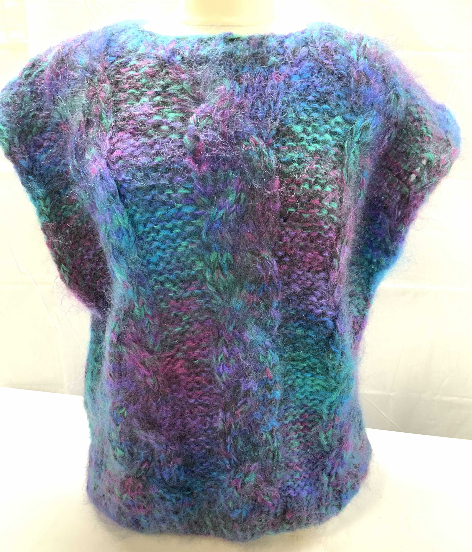 Bergdorf Goodman To Dye For Hand Knit Mohair Vest: Vibrant color mohair wool pull-over vest in teal, electric blue, magenta, & purple. Hand knit mohair, made in USA. 28 in. Long. 46 in. Waist. Plus size. Plus size luxury knitwear, Luxury brand hand kn