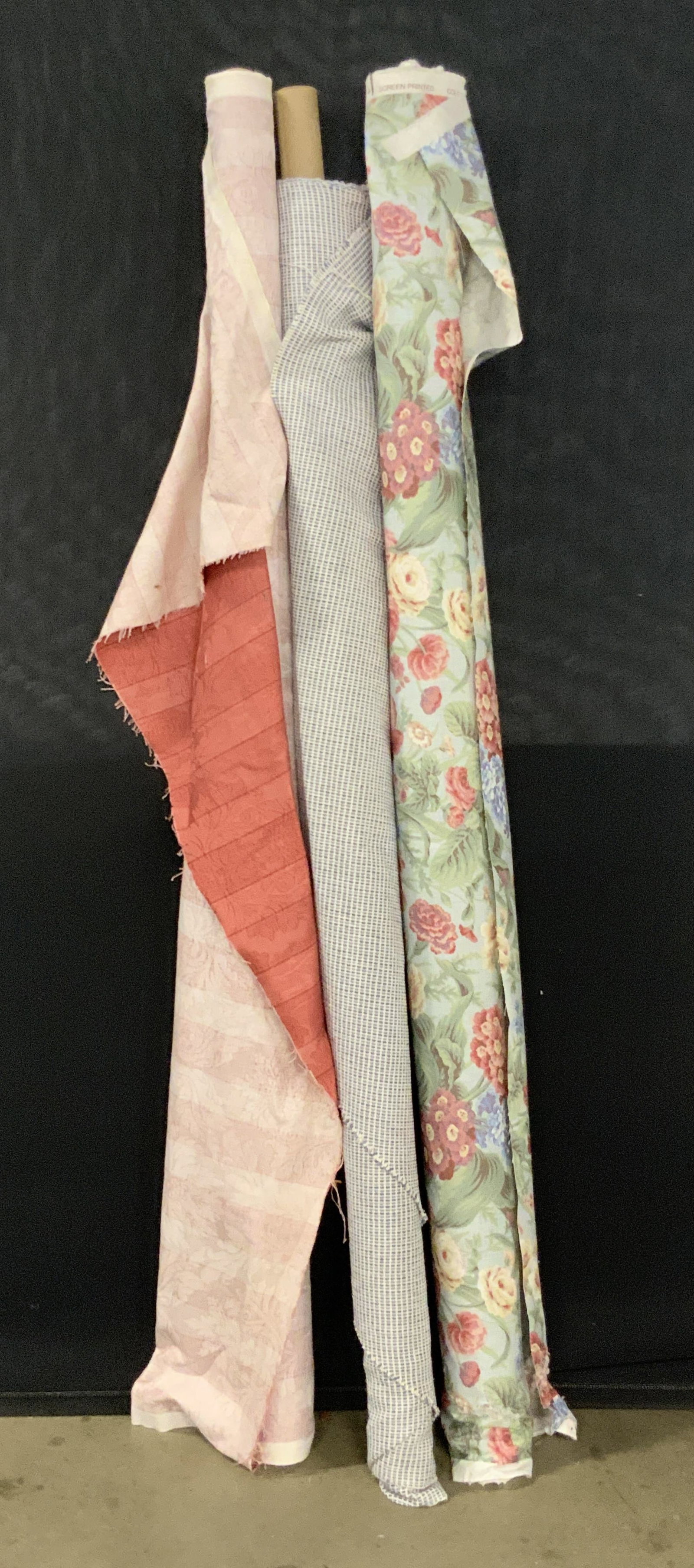 Lot 3 Bolts of Fabric, P. Kauffmann & More: Three bolts of fabric. One bolt of fabric reads Screen Printed and features a floral motif. Measures approx. 56.5H x 4W in. Measured as photographed. Another bolt reads Screen Printed as well and P. K