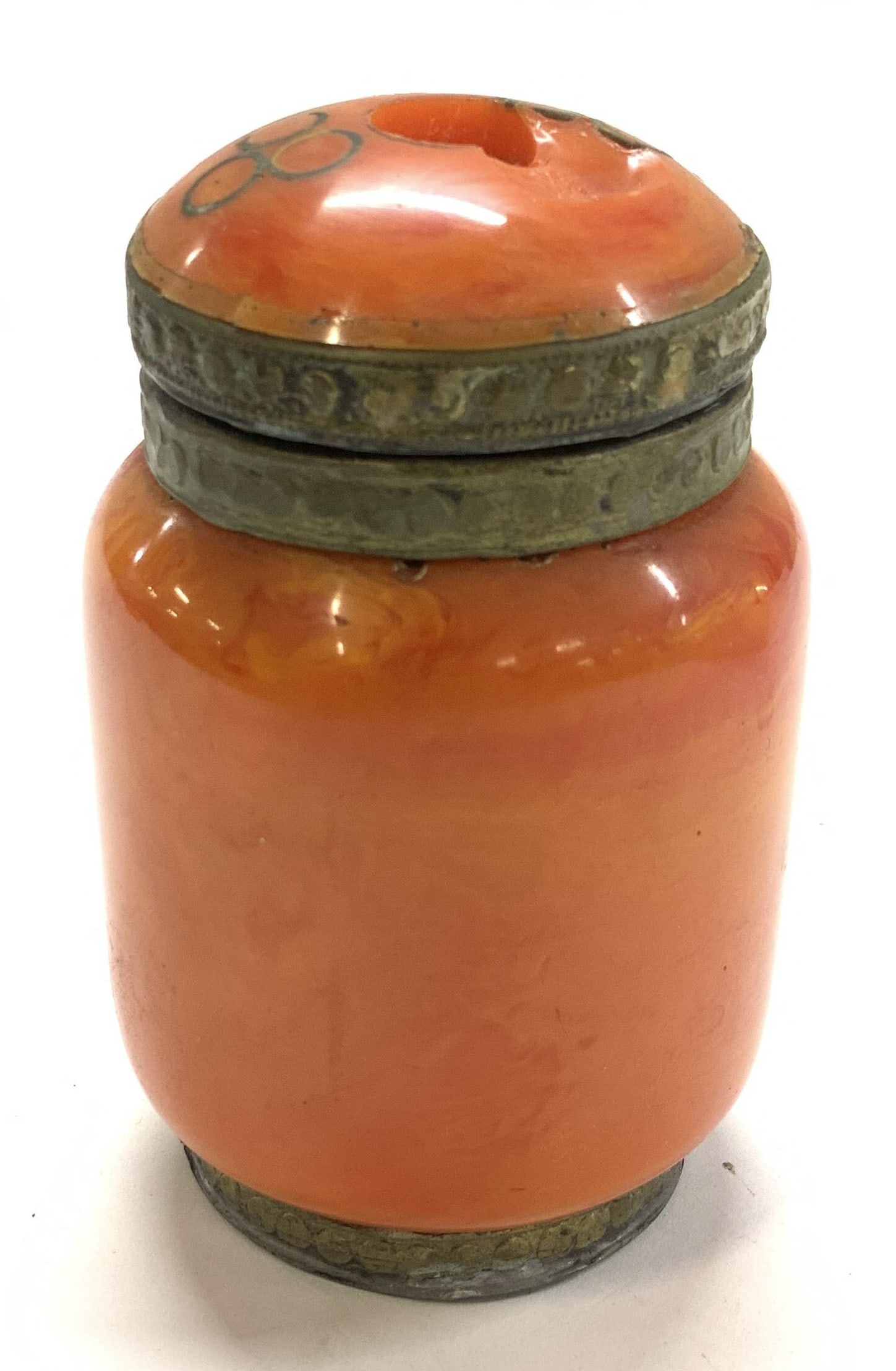 Moroccan Butterscotch & Metal Jar: Lidded jar/ box, possibly butterscotch Bakelite. Moroccan style. Brass tone metal trim and brass tone metal interior. Dented metal on under cap. Chip to cap. Has wear. Measures 3.75 in. Ht x 2.25 in. 
