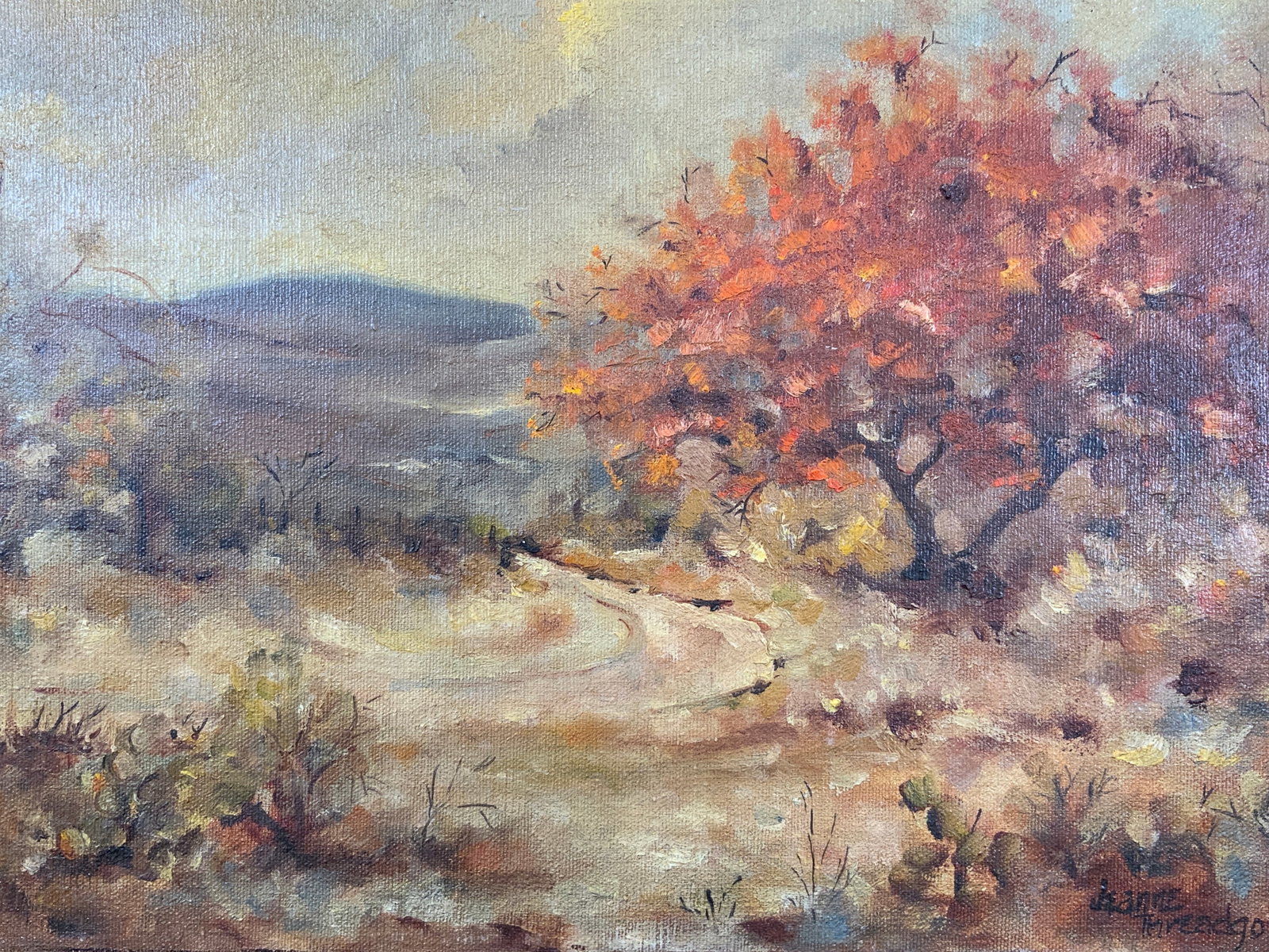 Jeanne Threadgold Fall Landscape Oil Painting: Oil paint on canvas. Signed in lower right corner by Jeanne Threadgold. Subject depicts a fall landscape with an autumn colored tree. Canvas measures approx. 16 W x 12 H in. Painting does not bleed on