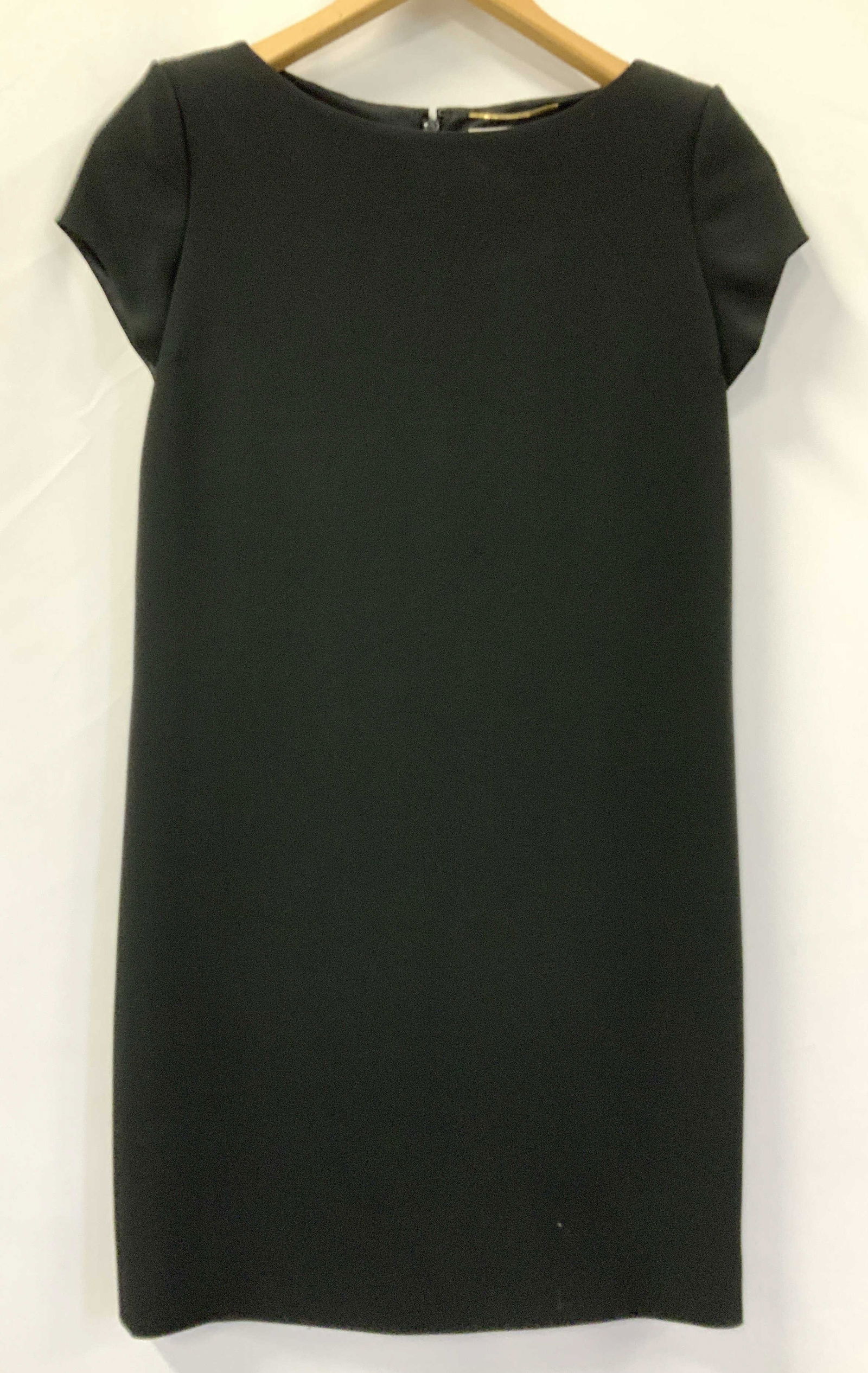 Saint Laurent Paris Black Dress, Italy: The perfect little black dress by Saint Laurent Paris. made in Italy. 32 in. Long. 32 in. Waist. Padded Cap sleeves. Interior silk lining. Dress is acetate and viscose. In like new condition. Luxury F