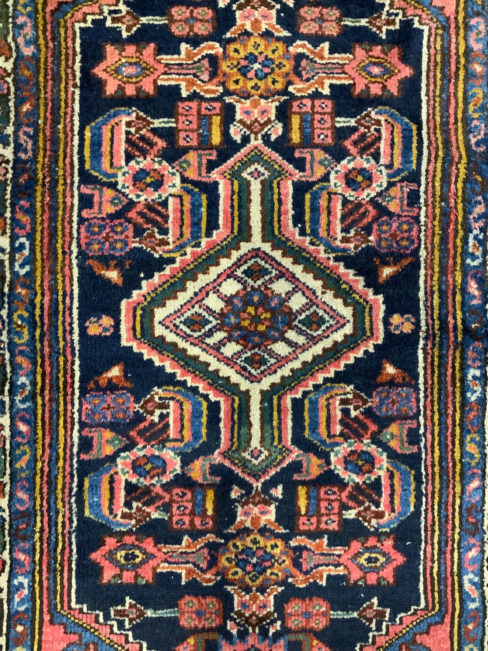 Vintage Handmade Persian Wool Area Rug: Rug is handmade and wool. Piece is vintage appears to be Persian. Rug has intricate multi toned Floral & geometric detail. Rug measures approximately 48 inches long 28 inches wide. Rug, carpet, area r