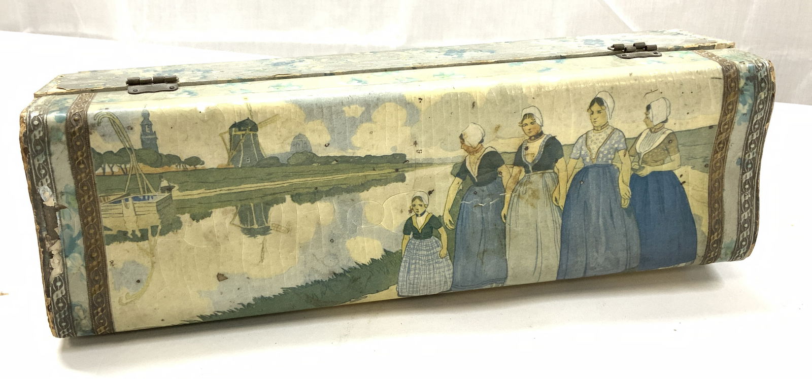 Antique Papered & Painted Hinged Wooden Box: Antique box with hinged lid, decorative latch. Papered wooden box lid with hand painted body featuring Dutch women walking along a river with a Windmill. Evident wear. Box measures 11.5 in. Long x 3.5