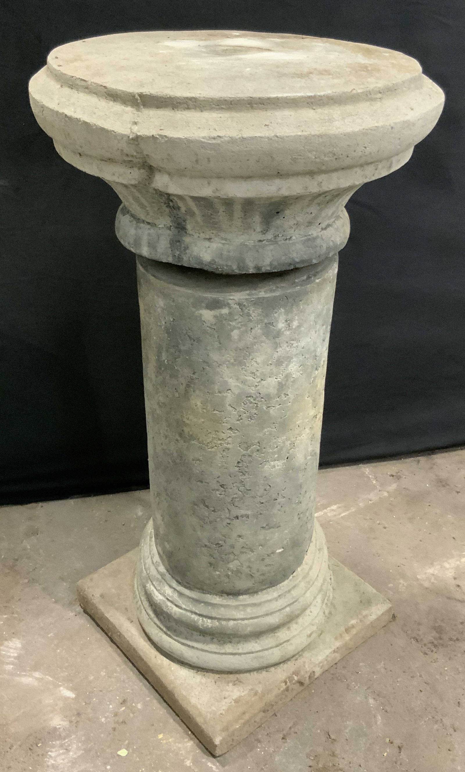 Vntg Cement Display Pedestal / Plant Stand 29.5in: A vintage cement display pedestal / plant stand. Measures approx. 29.5H x 15W in. Surface wear consistent with age, use, and exposure. Chipping and separation present. home decor, home accents, homewa