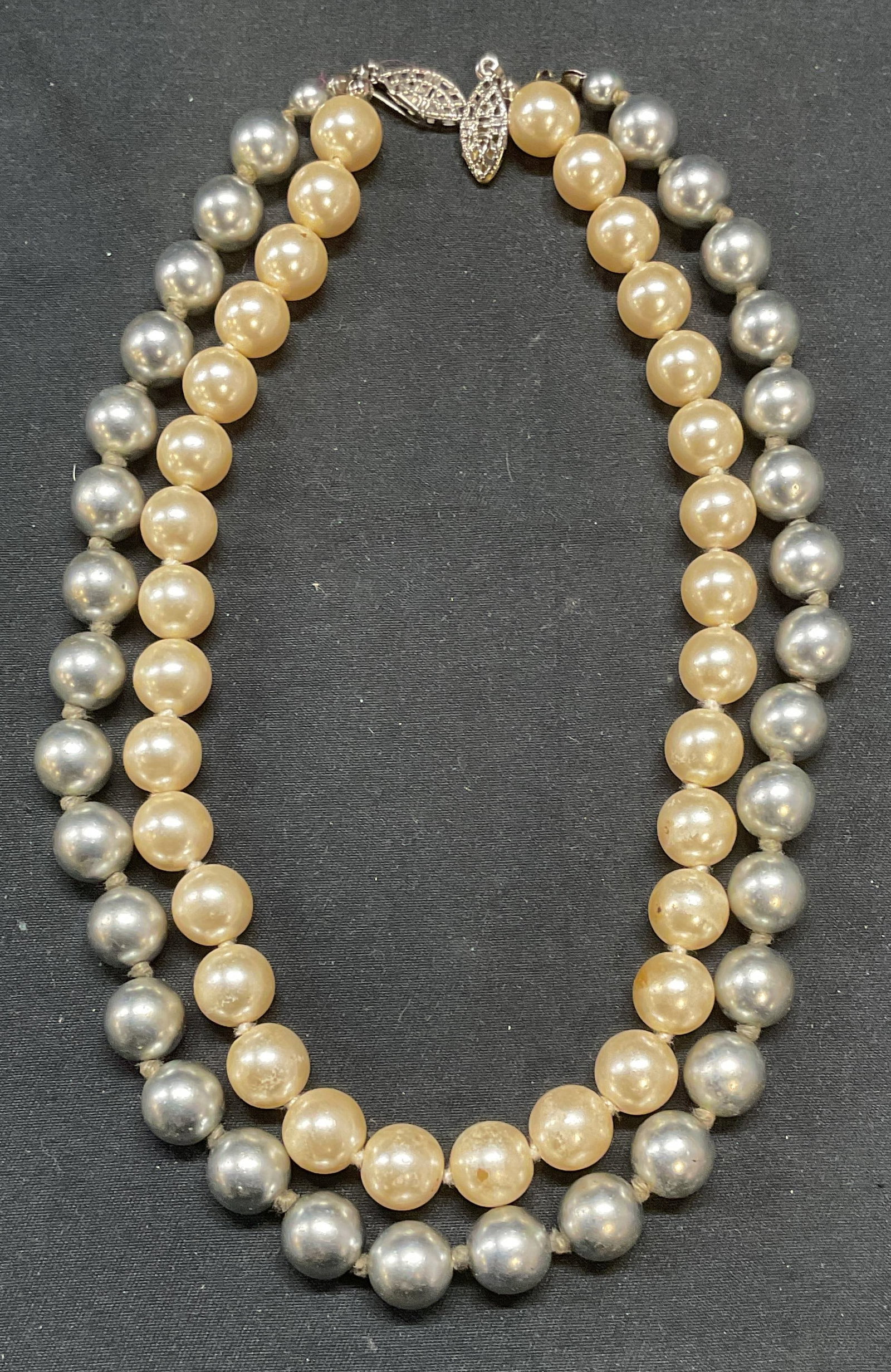 Lot 2 Vintage Faux Pearl Choker Necklaces: Lot of 2 vintage faux pearl choker necklaces. Faux white and Tahitian pearl beads on double knotted strings. Drop lengths vary slightly, longer necklace approx. 7 inches. Necklaces have weight. One cl