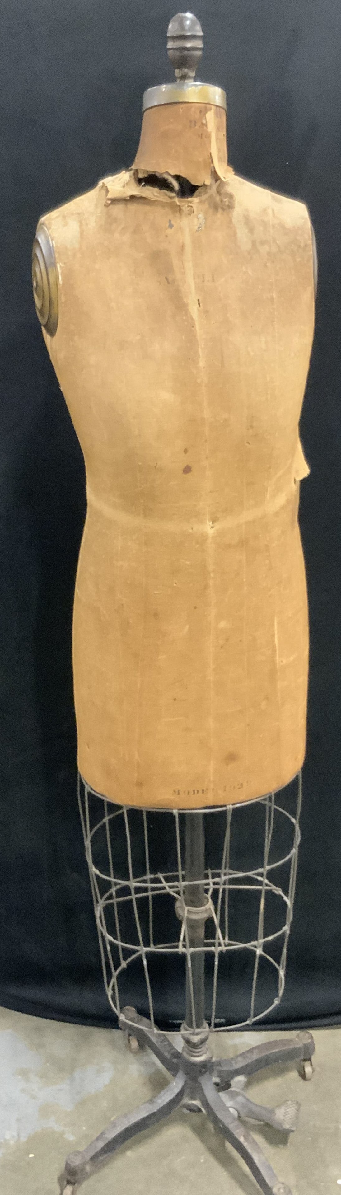 J.R. Bauman Vintage Dress Form Model 1939, Casters: J.R. Bauman Vintage Dress Form Mannequin Model 1939 on casters. Crafted from wood, fabric, metal, and iron. Numbers and verbiage to the obverse are worn, they possibly read Model 1939. Metal base read