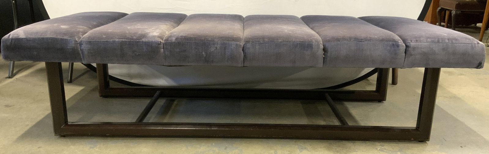 MCM Uph Bench W Wooden Supports: Bench is mid century modern. Piece has slate blue toned crushed velvet upholstery. Bench is mid century modern. Piece has brown toned wooden supports with stretchers in between. Bench measures approx 
