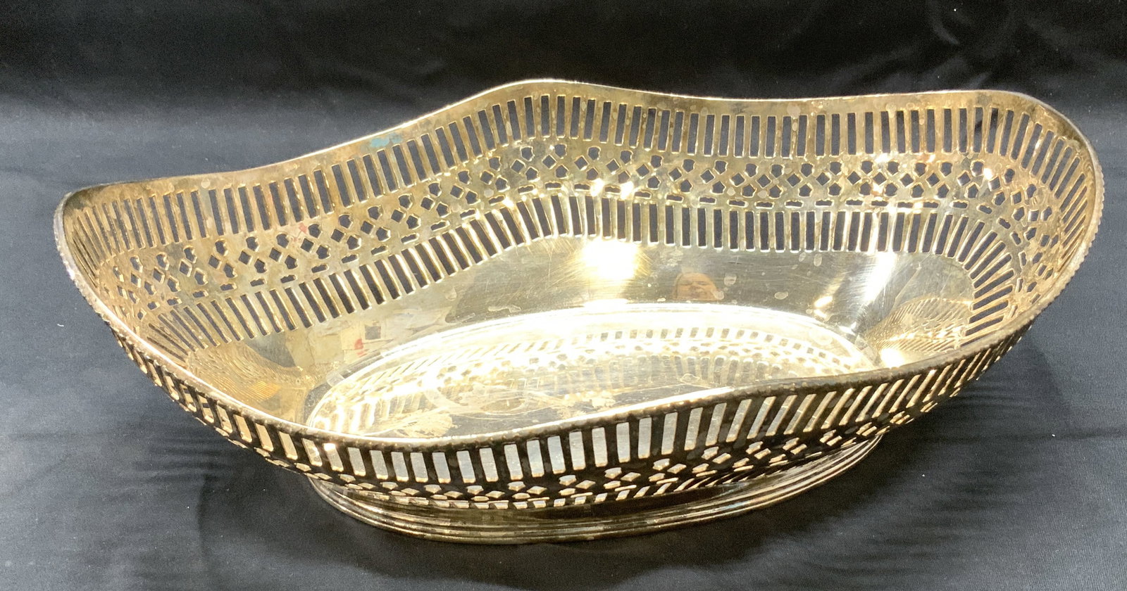 Silver Plate Basket w Trademark: Silver plate basket with pierced gallery. Trademarked image on verso and # 90. Basket measures 12.25 Long x 8.25 in. Wide x 4 in ht. at ends. Oxidation to areas. Tableware, Silver Plate table basket, 