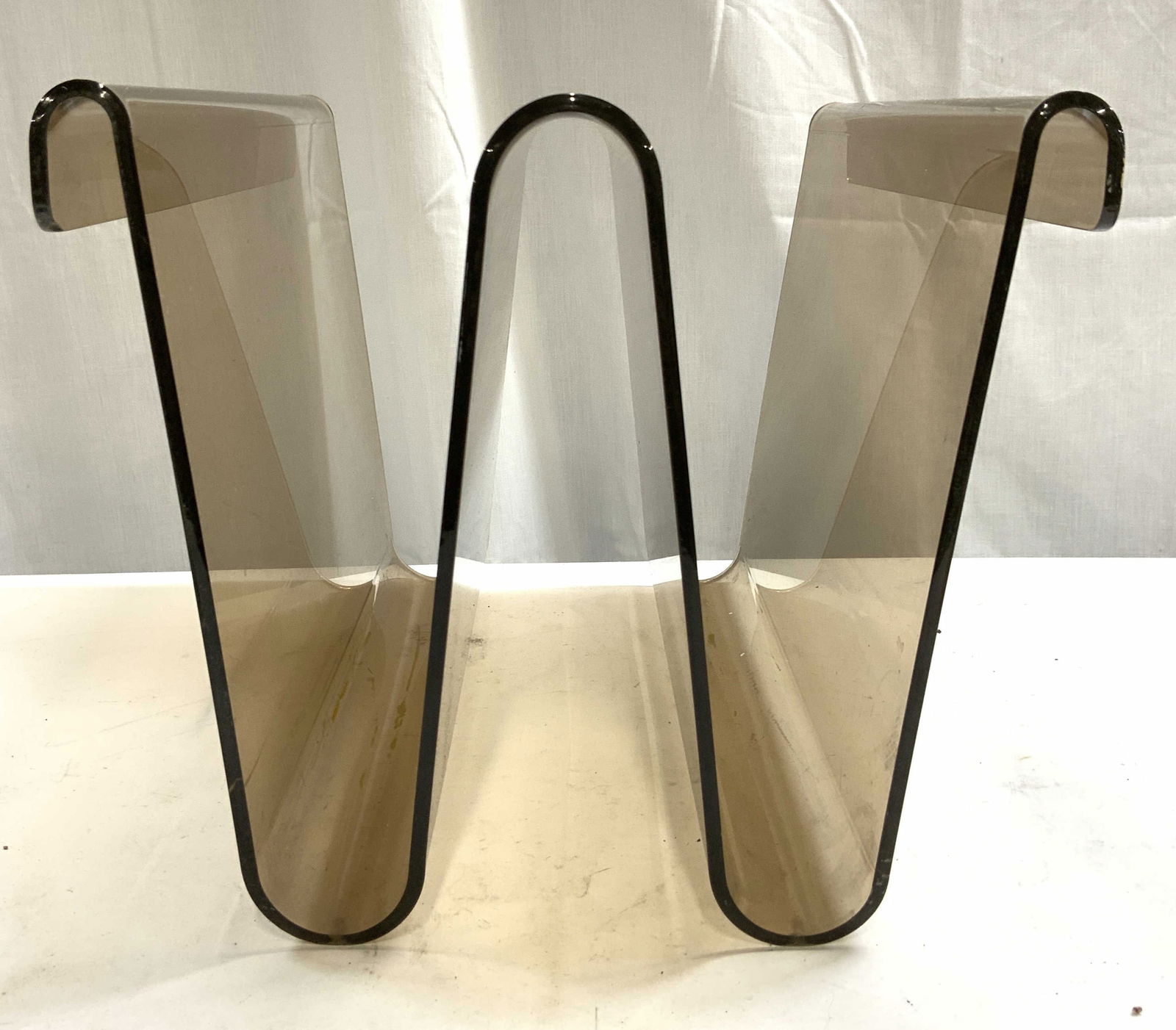 MCM Lucite Acrylic Magazine Holder Folder Holder: Folder holder is mid century modern. Piece appears to be lucite possibly acrylic. Magazine holder is tan toned. Piece has sculptural zig zag structure. Piece measures approximately 10 inches tall 11.5