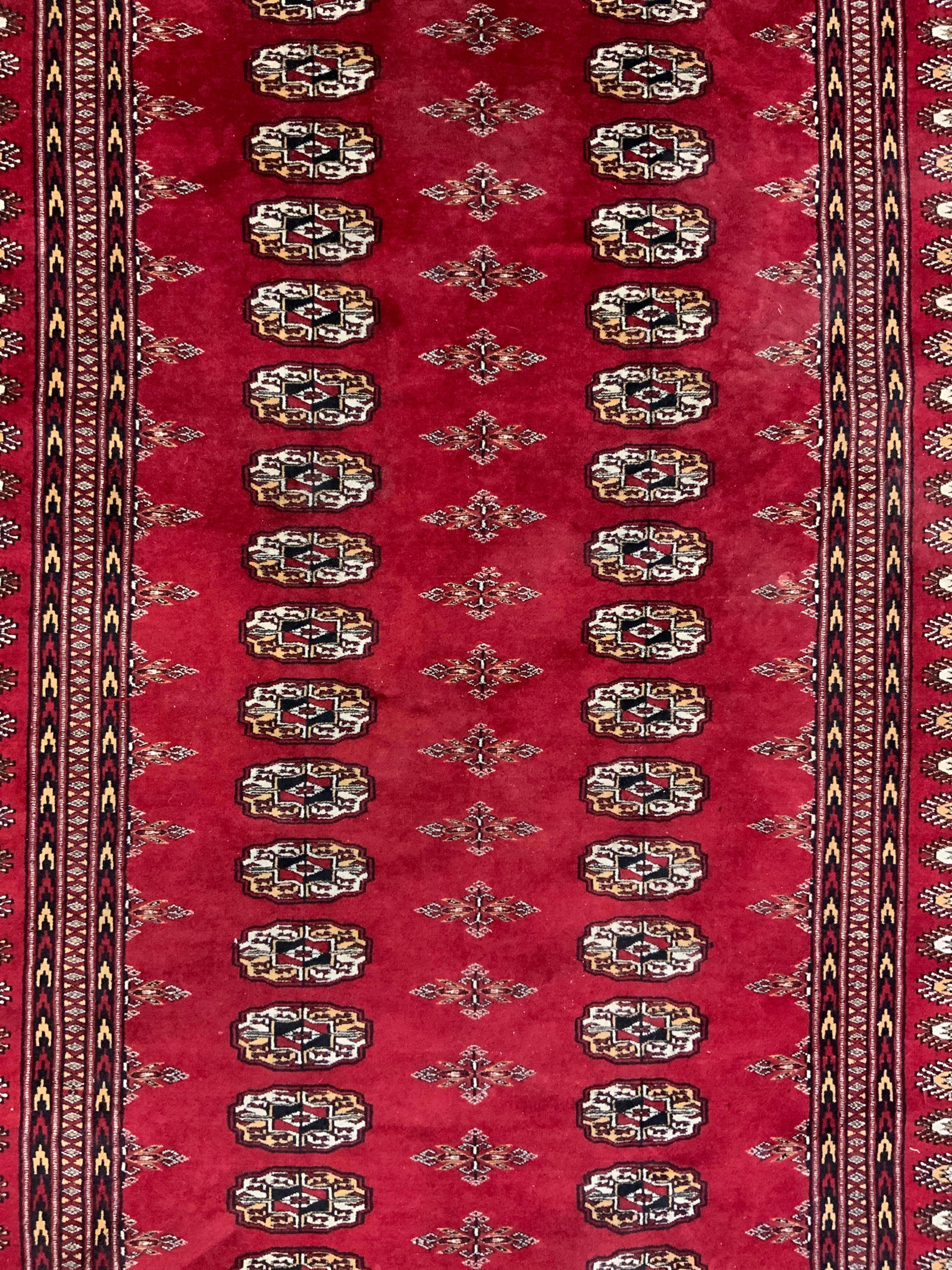 Vintage Handmade Bohkara Wool Area Rug: Rug is handmade and wool. Piece is vintage. Bohkara rug with intricate multi toned geometric detail. Piece has short cream toned fringes. Rug measures approximately 74 inches long 51 inches wide. Rug,
