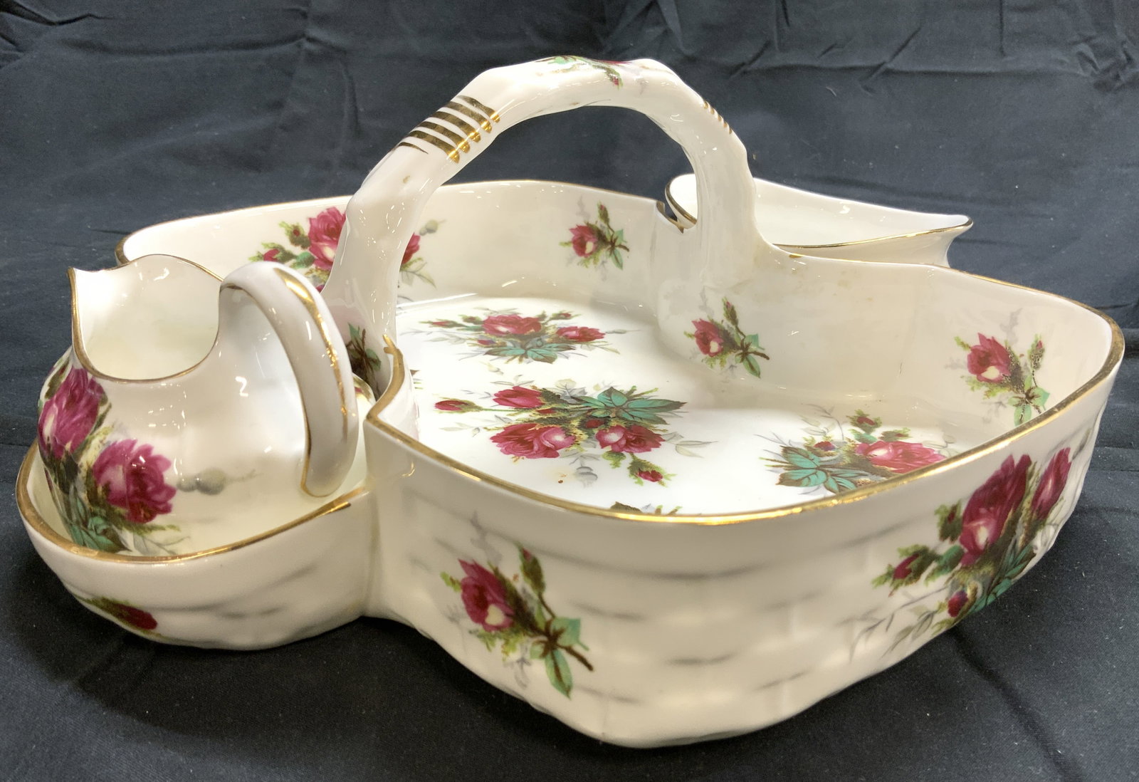 HAMMERSLEY GRANDMAS ROSE Set 3 Berries & Cream Set: Underside is marked GRANDMAS ROSE BY HAMMERSLEY. Lot includes 1 tray, 1 creamer dish and 1 berry dish. Each piece is white with multi toned floral & leaf detail. Pieces also have gold toned gilt rims.