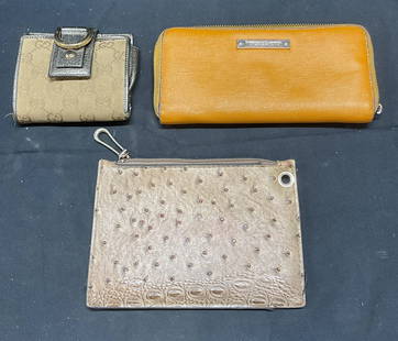 Lot 3 Vince Camuto Orange Leather Wallet +: Lot of 3 wallets and pouch. Vince Camuo orange leather wallet. Zipper closure with multiple pockets to interior. Signed on plaque. Tan monogram fabric wallet. Snap closure. Multiple pocket to interior