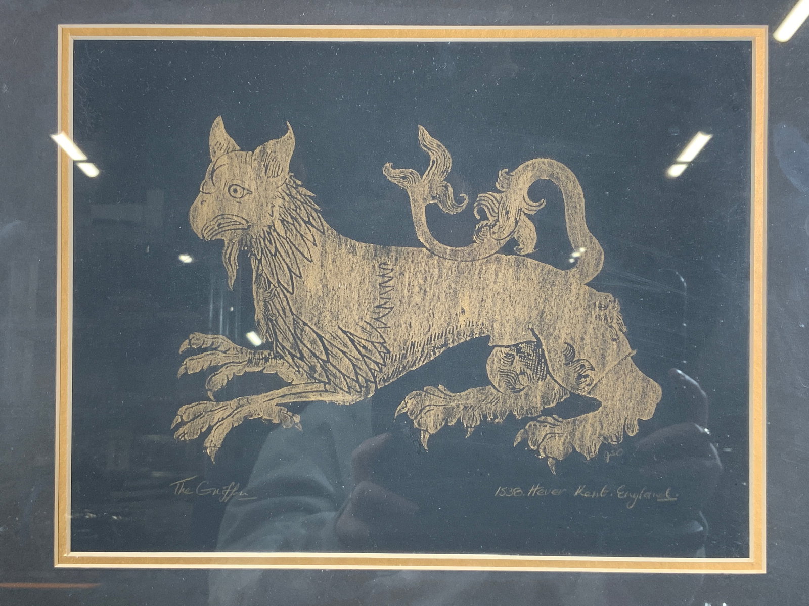 Framed Vintage The Griffen Brass Rubbing: Brass rubbing. Titled The Griffen. Lower right corner reads 1538 Hever Kent. England. Subject depicts a Griffen with a tail and birds head. Framed in a gilt wooden frame. Frame measures approx. 17.5 W