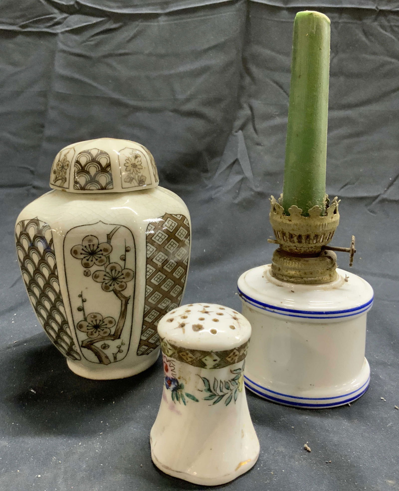 Lot 3 Urn W Lid Salt Shaker & Candlestick: Lot includes 1, Salt shaker 1 candlestick & 1 urn. Each piece is vintage and porcelain. Urn is white with brown toned geometric pattern & floral detail. Urn includes lid. Salt shaker has multi toned f