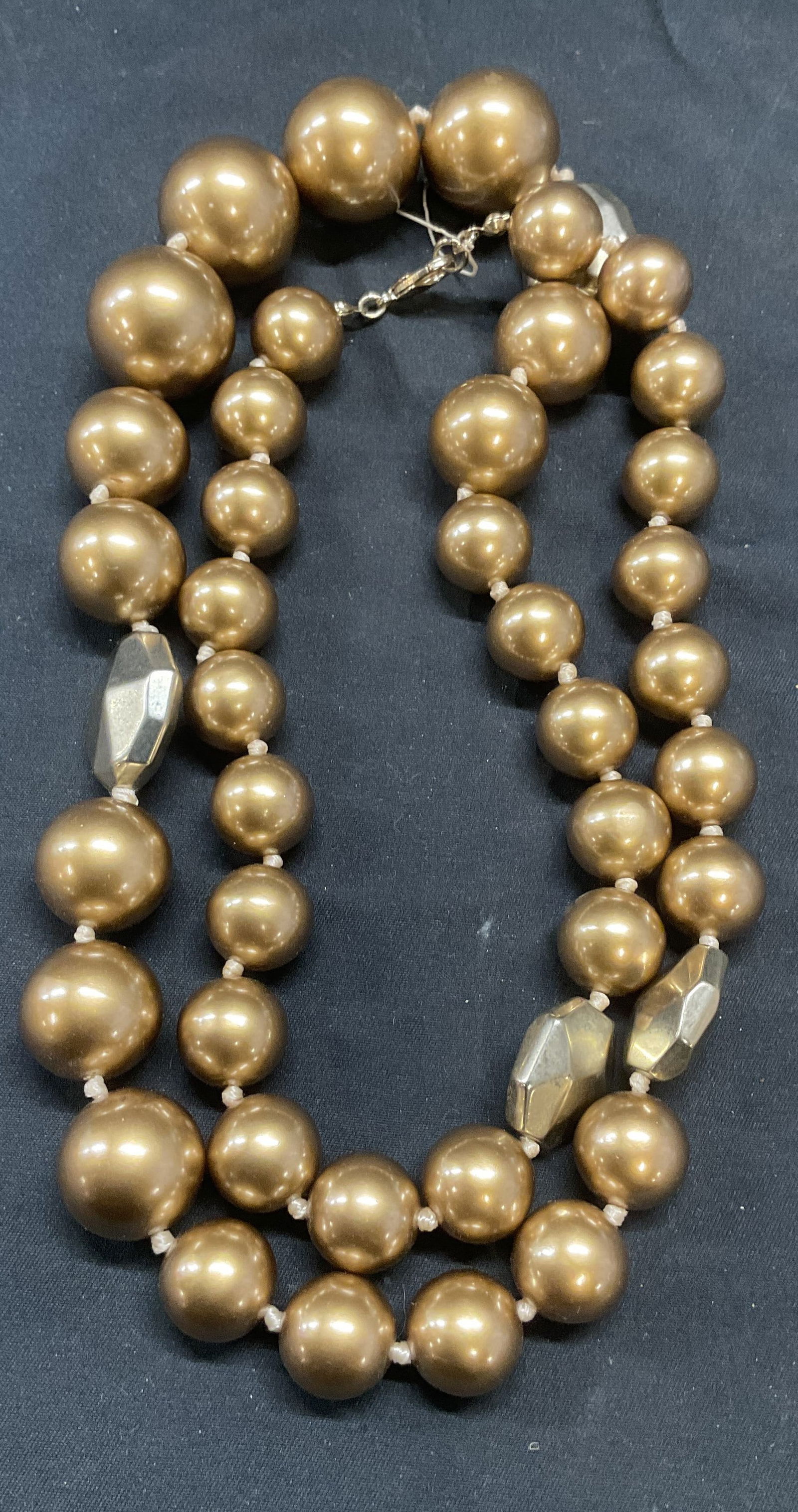 Chunky Gold Tone Beaded Necklace: Chunky gold tone beaded necklace with crystal motif accents on double knotted string. Drop length approx. 16 inches. Necklace has weight. Some surface wear including scratching observed. Jewelry, esta