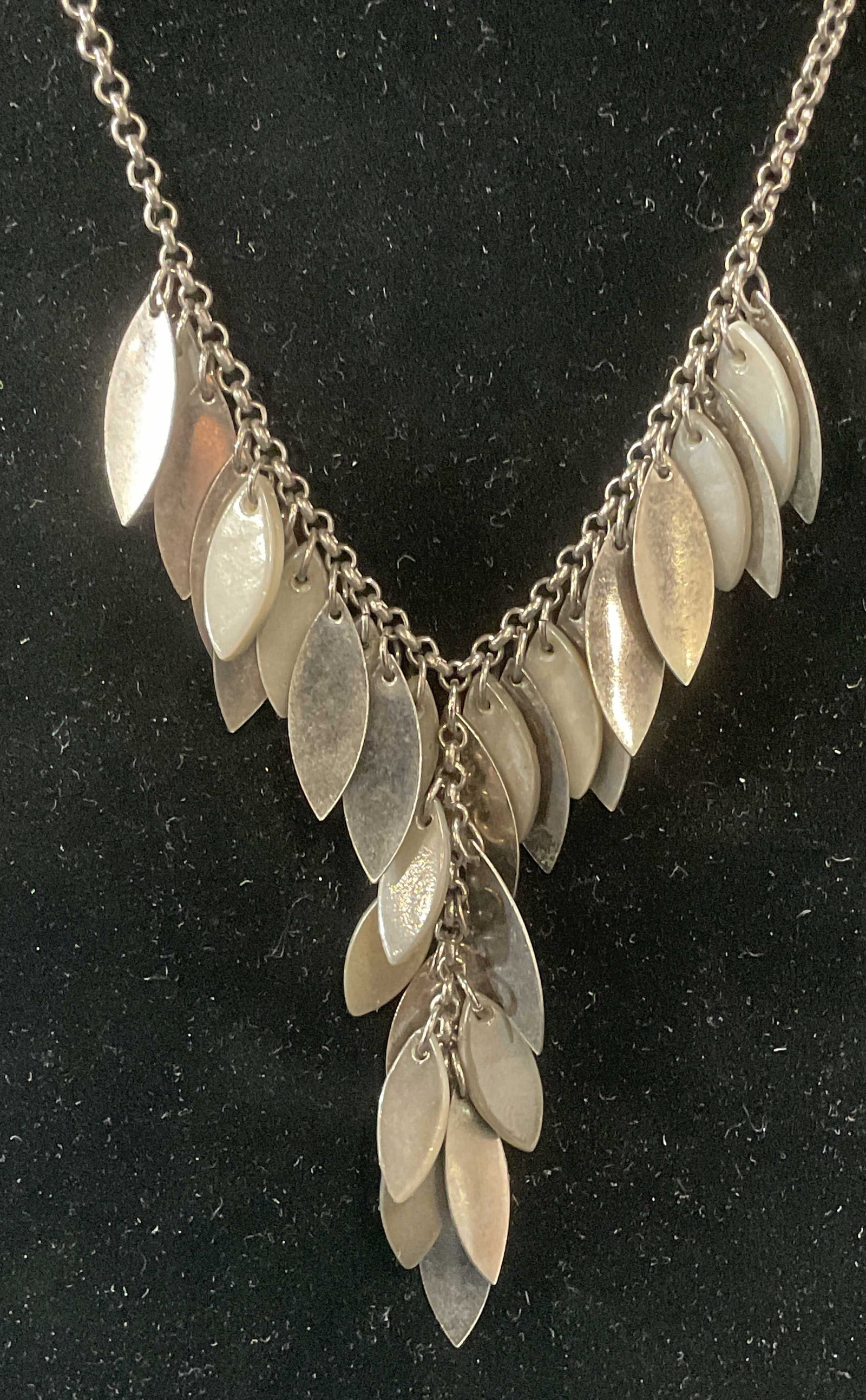 Laila Rowe Silver Tone MOP Style Necklace: Laila Rowe silver tone necklace with silver tone mother of pearl style pendants. Signed on hang tag. Drop length approx. 9 inches. Some surface wear including scratching observed. Jewelry, estate jewe