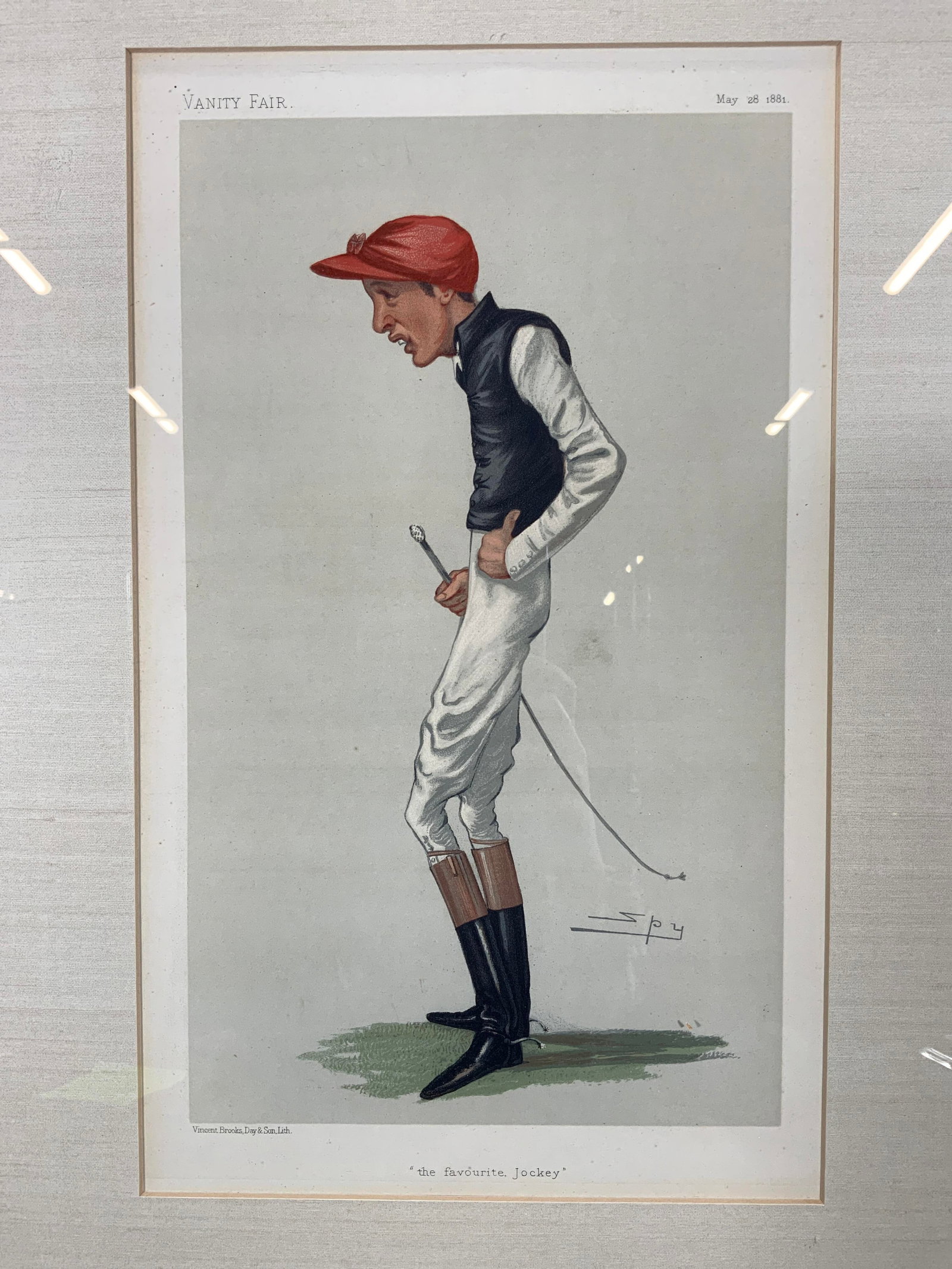 VANITY FAIR Fred Archer The Favorite Jockey: Lithograph on Paper. Vanity Fair 1881 illustration by Spy, also known as Fred Archer. Titled The Favorite Jockey. Published by Vincent Brooks, Day & Son, Lith. Subject depicts a skinny, buck tooth joc