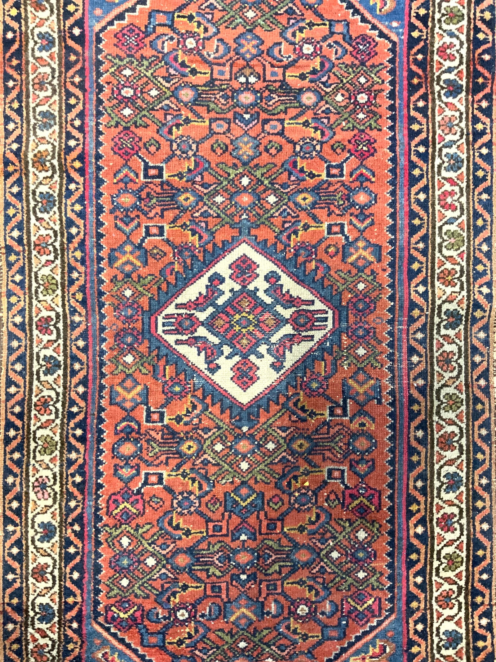 Vintage Handmade Persian Wool Area Rug: Rug is handmade and wool. Piece has intricate multi toned floral motif & geometric derail. Rug is vintage. Piece measures approximately 49 inches long 29 inches wide Rug, carpet, wool rug, Persian rug