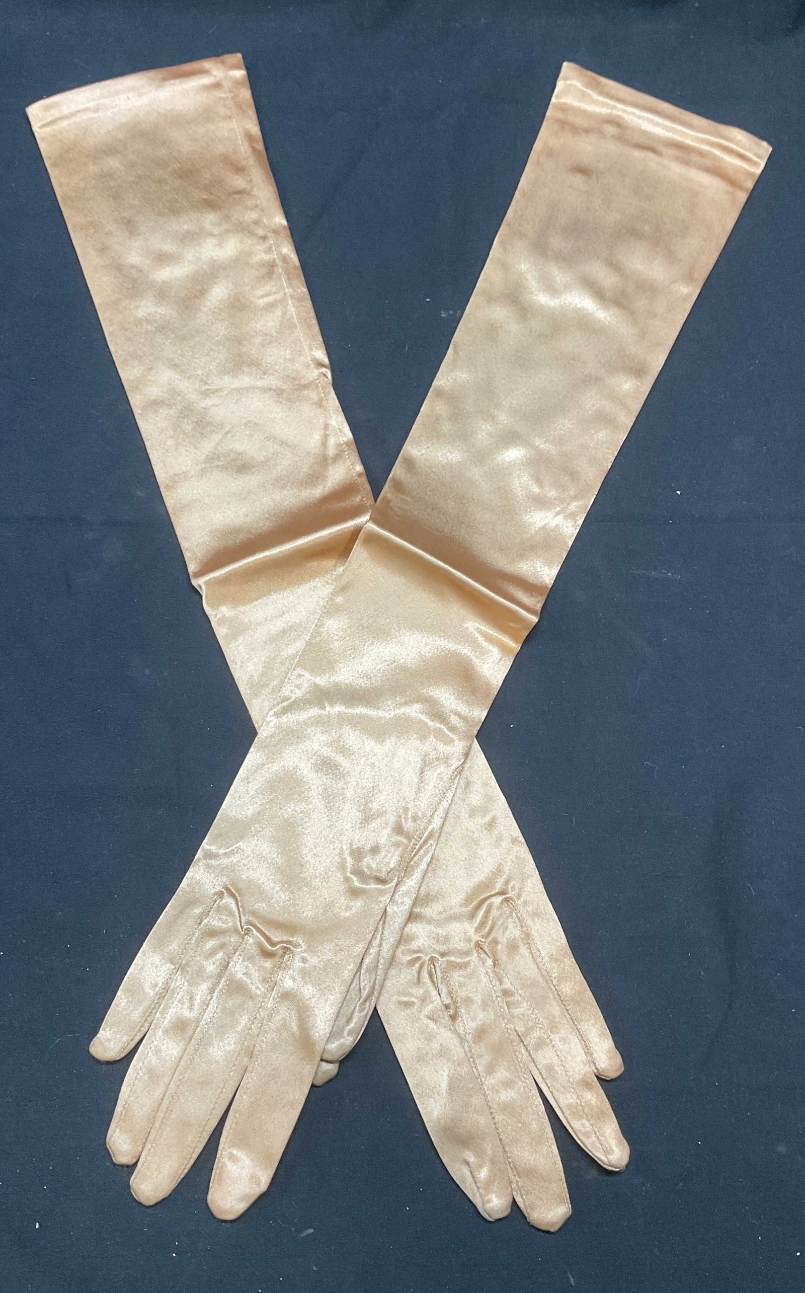 Vntg Stretchies Gold Satin Long Gloves, France: Vintage Stretchies gold tone satin long gloves. Made in France. Acetate blend. Measure approx. 19.5 inches long. Some wear to material consistent with exposure. Stretchies, Stretchies gloves, ladies d
