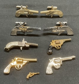 7 Silver & Gold Tn Gun Motif Pendants, Cufflinks