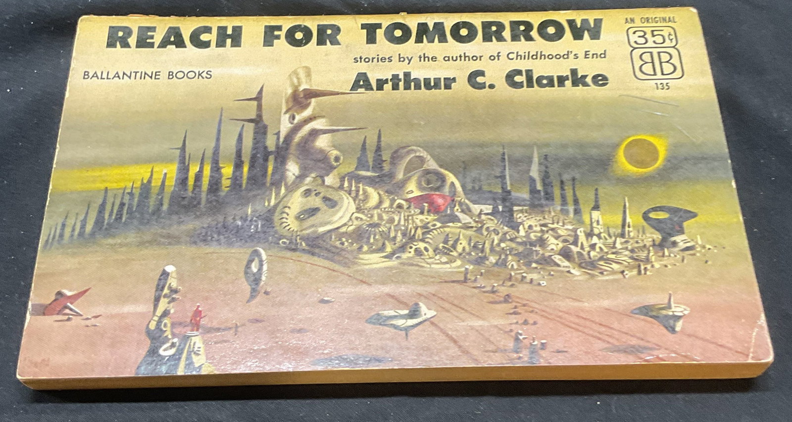 Reach For Tomorrow Arthur Clark Sci Fi 1956: Softcover copy of Reach For Tomorrow stories by Arthur C. Clark. Published by Ballantine Books, 1956. Measures approx. 7 x 4.25 inches. Some wear to cover, pages, and binding consistent with exposure.