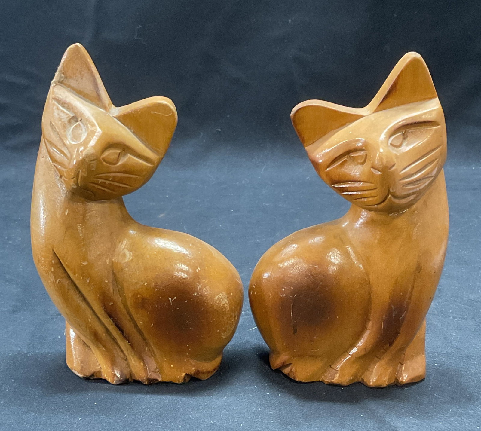 Pair Carved Wood Cat Figurals: Pair of carved wooden cat figurals. Measure approx. 3.75 x 1.5 x 6 inches each. Both pieces have some surface wear including scratching observed. Cat, wood cat, cat figurals, decorative arts, home dec
