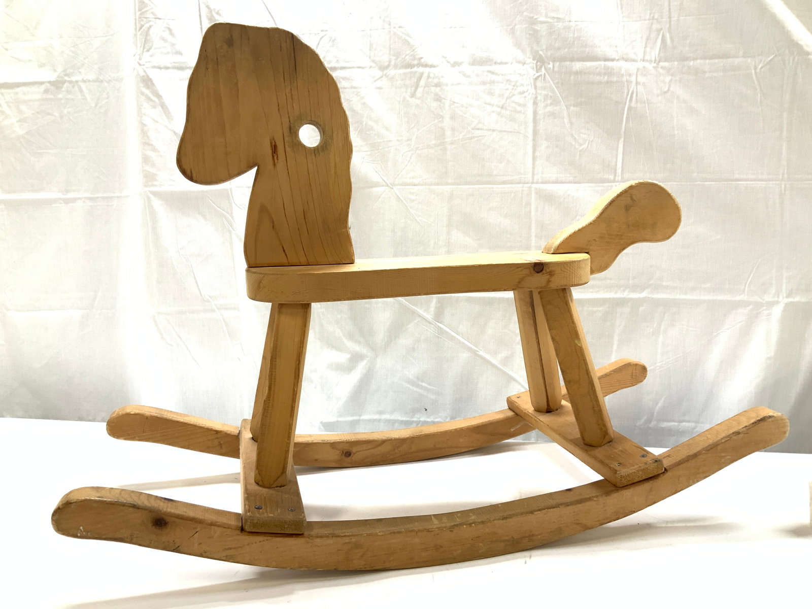 Childrens Wooden Rocking Horse 35 in. L: Hand crafted wooden rocking horse. 35 in. L x 24 in. Ht x 13.5 in. W. Solid and sturdy. Has scratching consistent with use and exposure., Wooden ride toys , Rocking horse, nursery room decor and acces