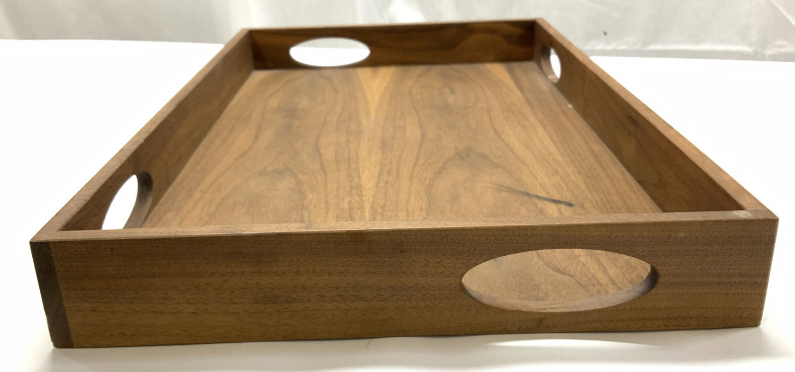 Acacia Scandinavian Style Tray With Handles: Acacia wood serving tray with modern style oval handles. Measures 22 x 14 in. 2.25 in ht. Scratches observed & a marker pen discoloration. Modern style wood tray, serving tray, bed tray, tableware, ac