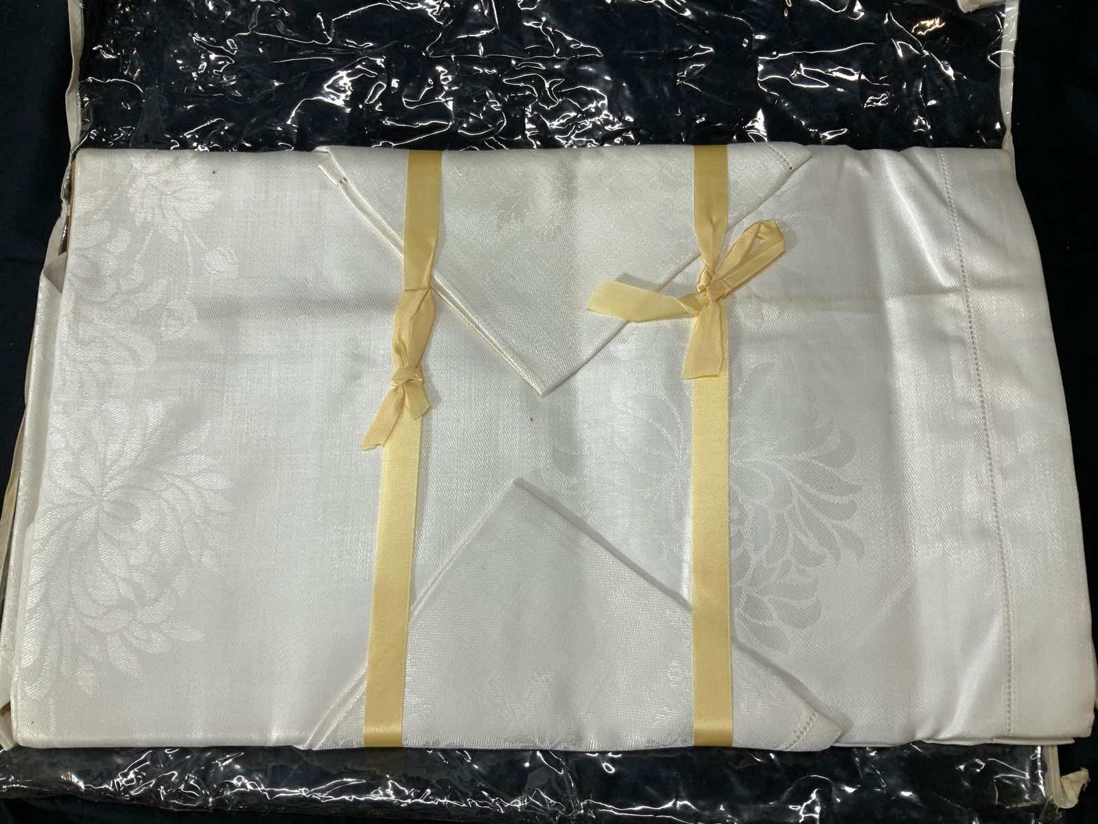 NIP Cream Linen Tablecloth w Napkins, 5 Ireland: Chrysanthemum pattern cream toned lined damask tablecloth with 4 napkins. New in package, new old stock. Made in Ireland. Tablecloth measures 52 x 68 in. 4 napkins, measure 13 x 13 in. Mild discolorat