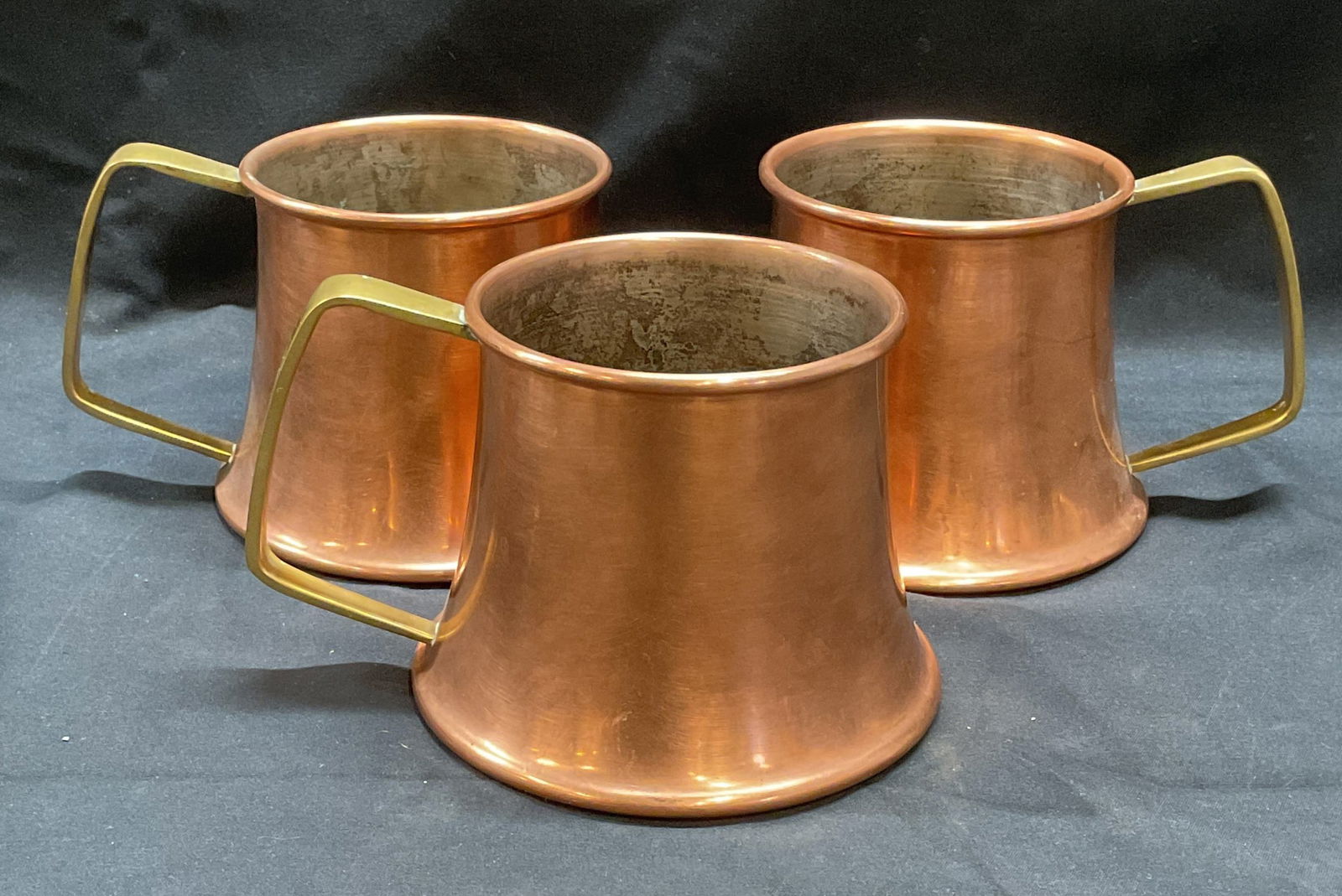 Set 3 Vintage Copper Cups with Handles, Italy: Set of 3 vintage copper cups with brass handles. Marked made in Italy. Measure approx. 4.75 x 3.5 inches each. All pieces have some surface wear including scratching observed. Copper cups, copper mug,