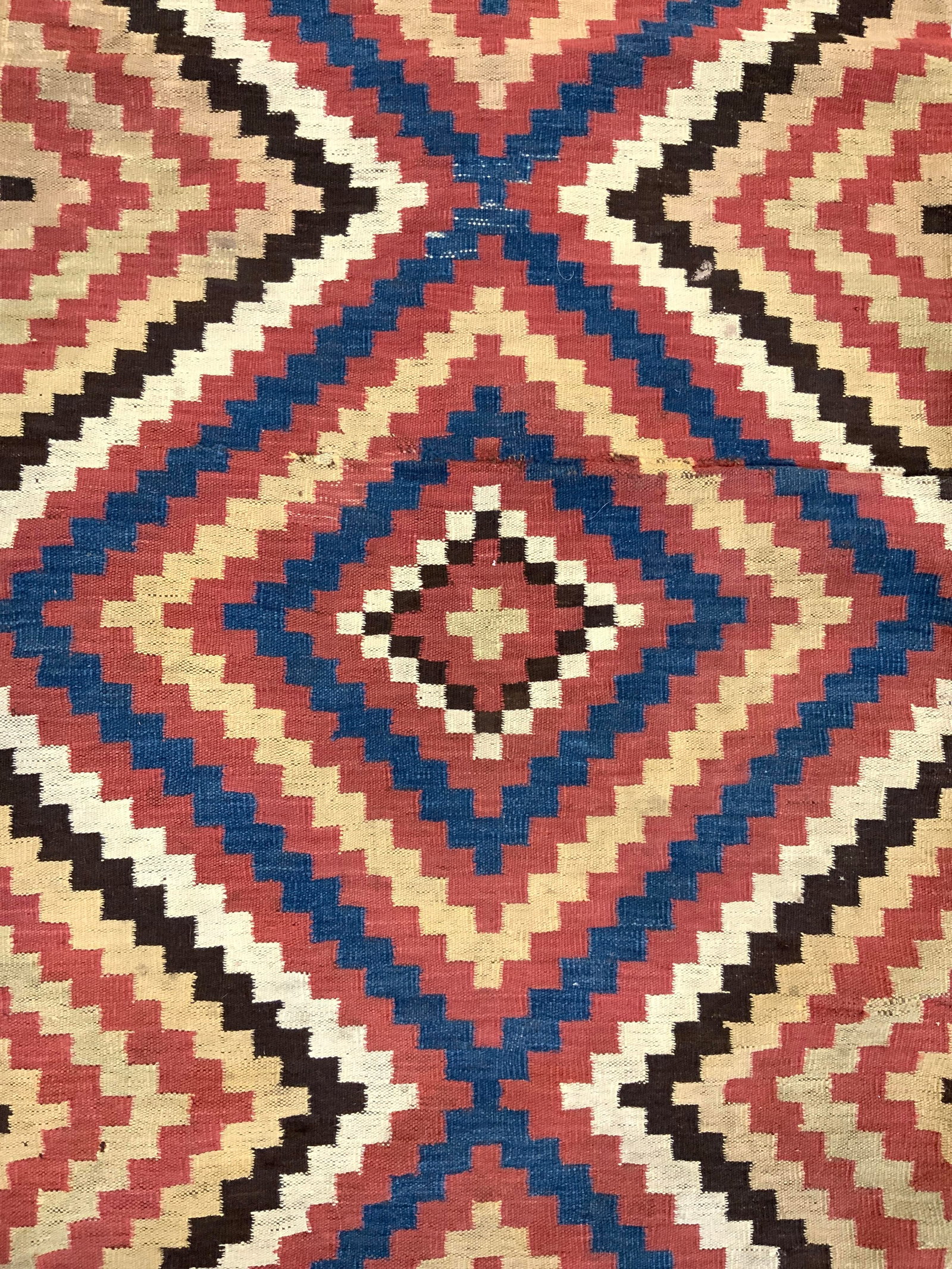Vintage Handmade Kilim Wool Area Rug: Rug is handmade and wool. Piece appears to be vintage. Rug appears to be Kilim. Piece has multi toned geometric detail. Rug measures approximately 135 inches long 70 inches wide. Rug, carpet, area rug