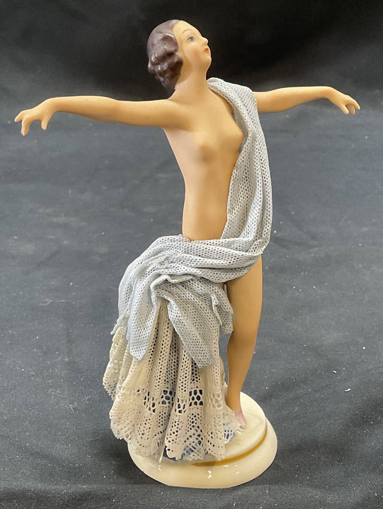 Vintage Signed Porcelain Nude Figural: Vintage porcelain figural. Nude woman motif with lace drapery. Signed illegibly to underside. Measures approx. 4.5 x 2 x 5.75 inches. So,r surface wear including scratching observed. Nude figural, nud