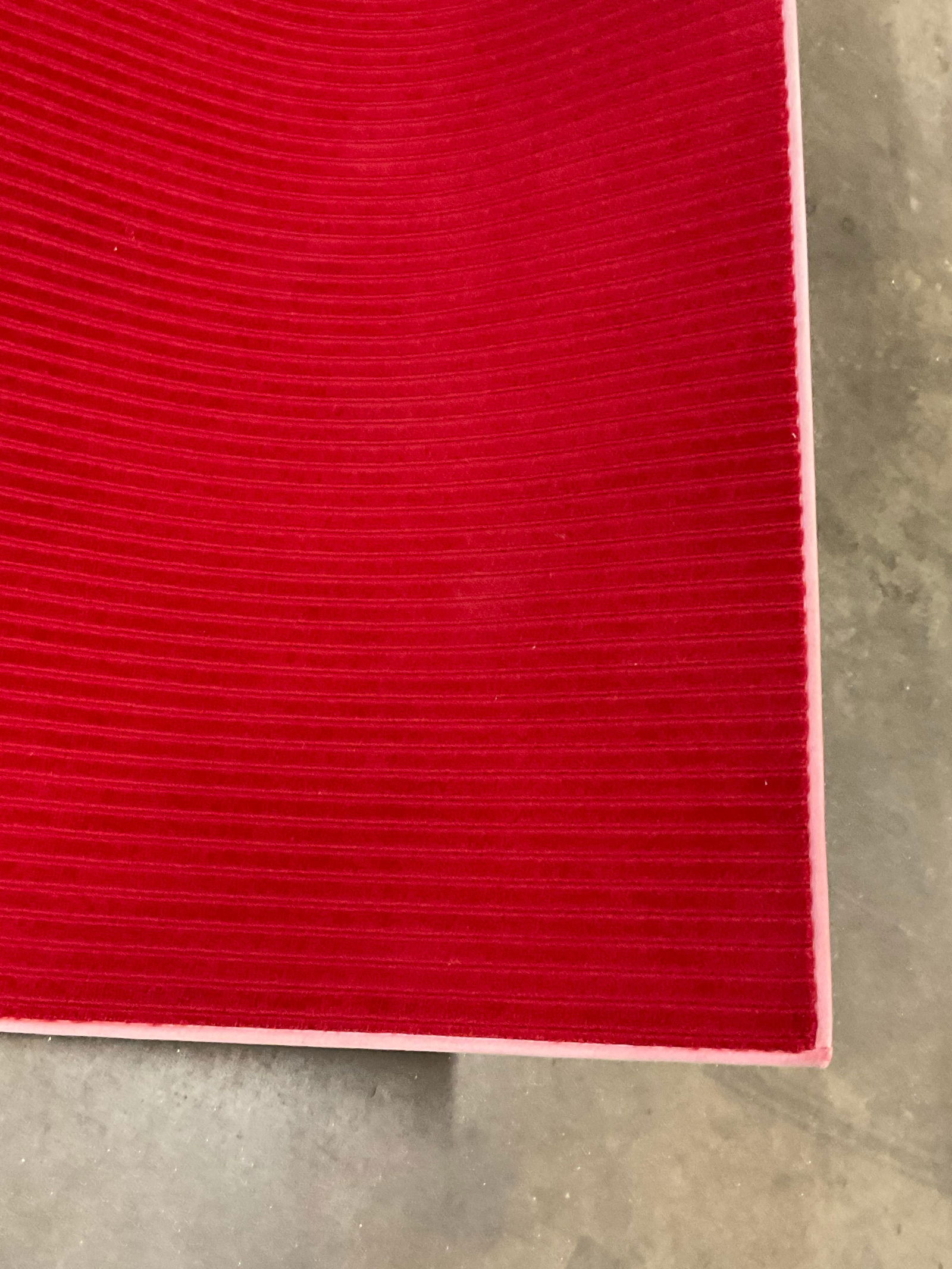 STARK CARPET USA XL Room Sized Rug: A red Stark rug. Full rug not inspected / unrolled. Measures approx. 180L x 180W in. Tag to reverse reads STARK CARPET USA. No material tag, possibly wool. Losses to fabric, discoloration, and surface