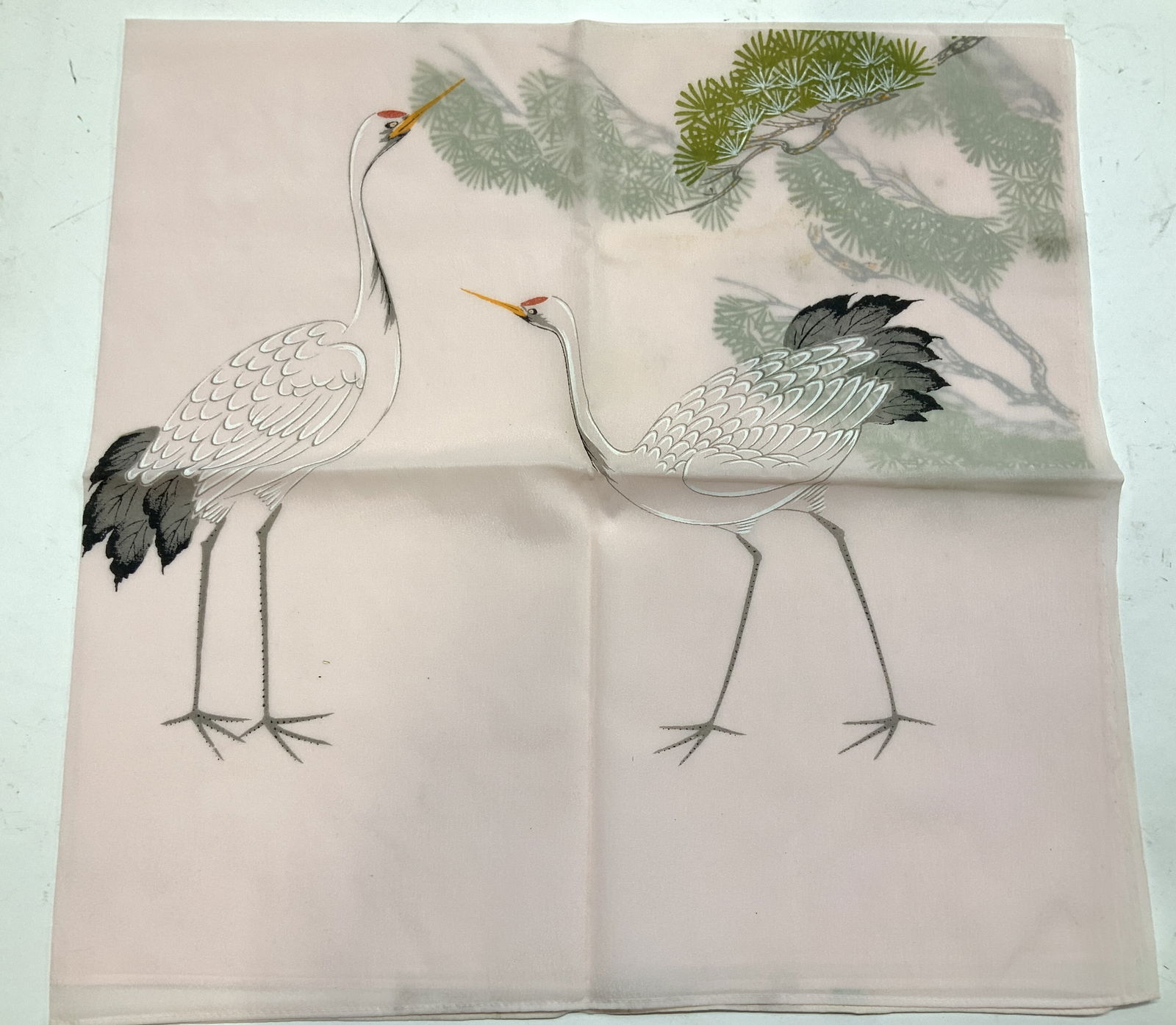 Hand Painted Fabric w Asian Cranes & Tree: Semi Sheer nylon fabric in a light pink. Hand painted to one side with 2 cranes and partial Asian tree branch . A bit of discoloration near painting. Fabric measures 35.5 in. Wide x 34.5 in. Ht. Decor