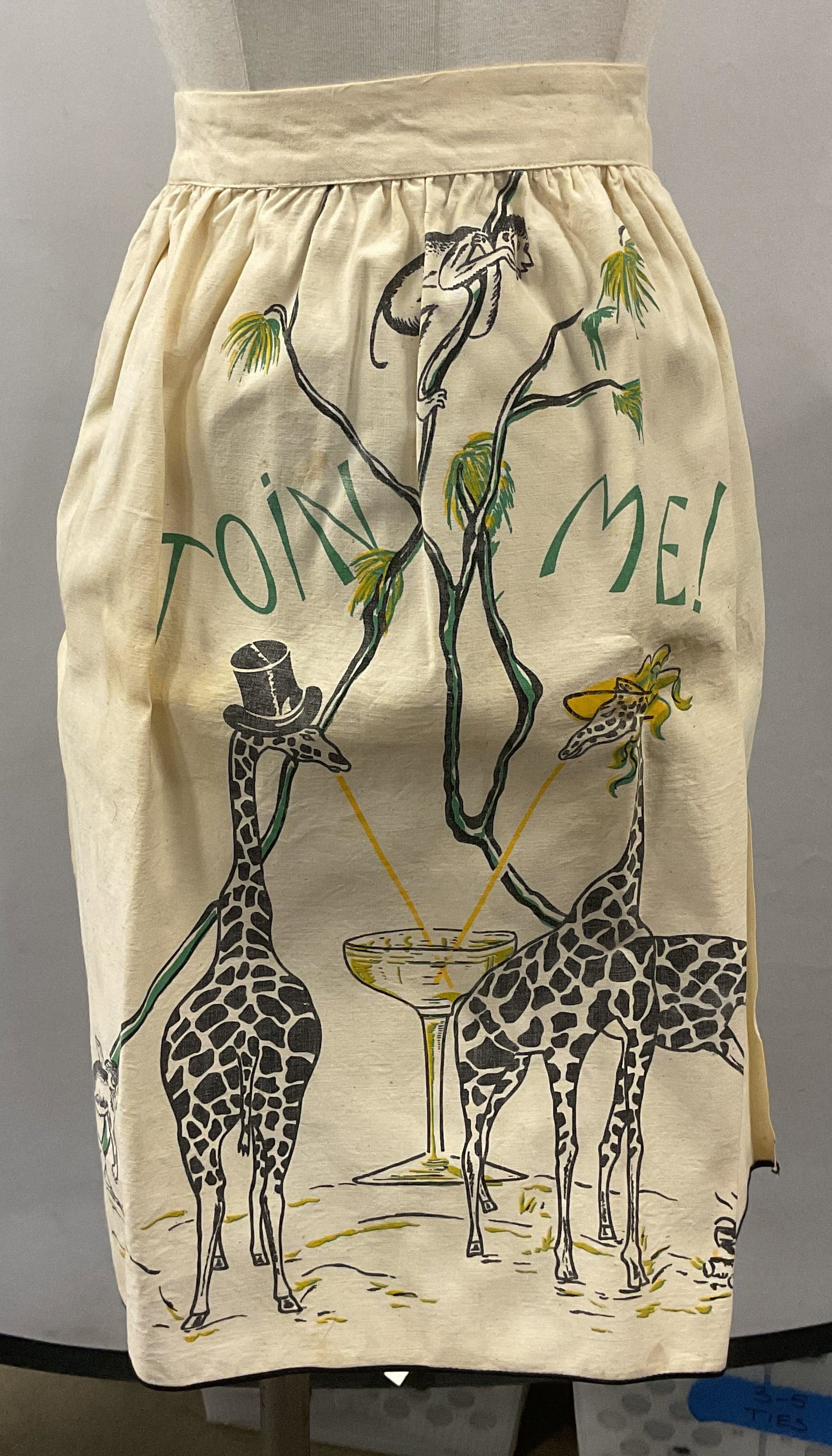 Vintage Giraffe Cocktail Motif Waist Apron: Vintage waist apron. Giraffe and cocktail motif. Reads Join Me. Material feel like cotton. Measures approx. 16.5 inches wide at waist. Some wear to material including blemishes observed. Apron, waist 