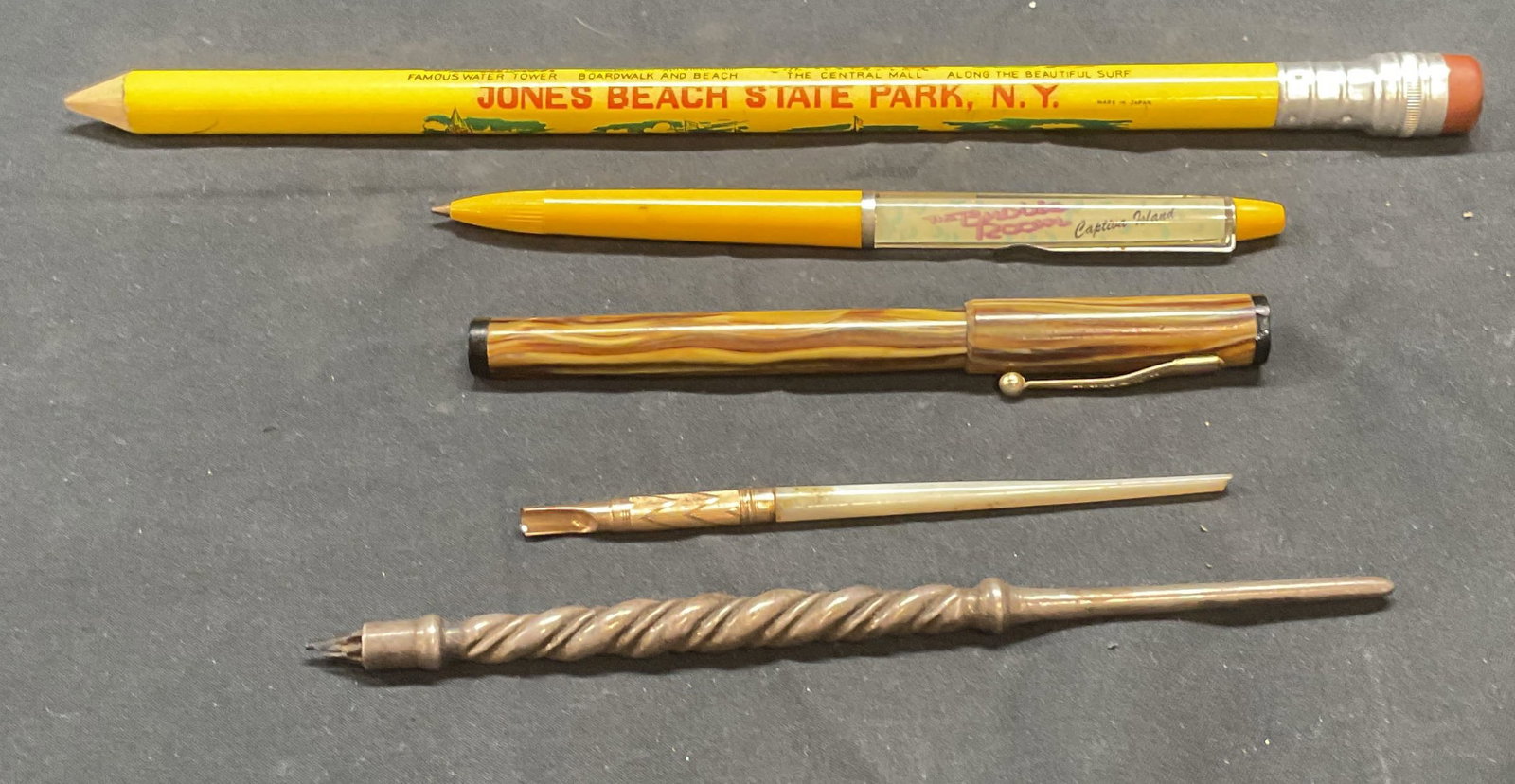 Lot 5 Jones Beach Souvenir Pencil, Banker Pen +: Lot of 5 vintage writing utensils and accessories. Oversized Jones Beach State Park New York wooden souvenir pencil. Captiva Island The Bubble Room pen. Banker fountain pen with iridium nib. Two misce