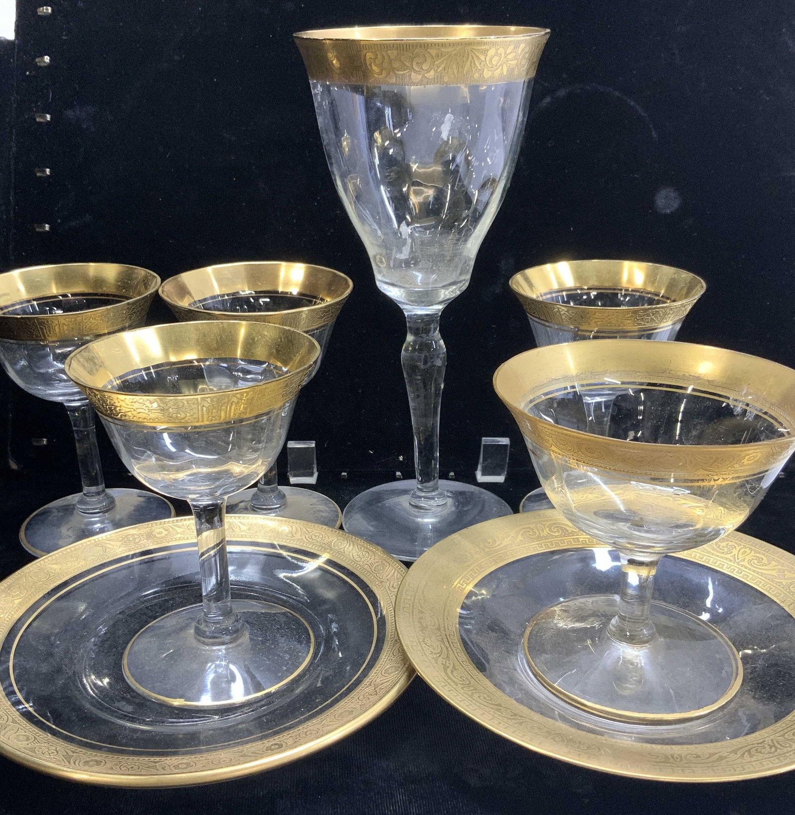 Set 8 Blown Glass & Gilt Tableware: Vintage hand blown glassware with embossed sold gilt border. Set 4 aperitif glasses, 1 red wine glass ( approx 7.75 in. Tall x 3.5 in. Wide), 1 shrimp cocktail glass ( has the most gilt wear) , 1 dess