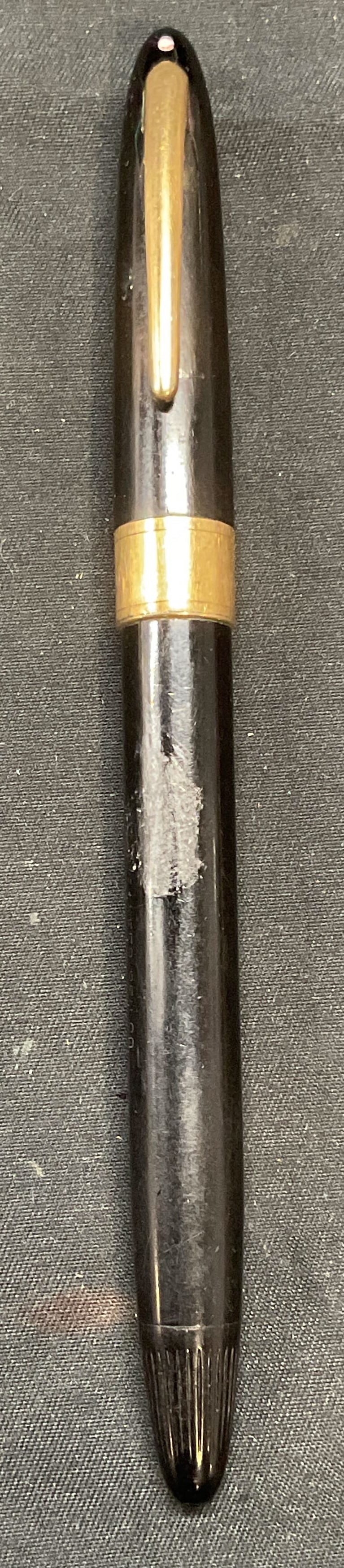 Vintage SHEAFFER 14K Gold Tipped Pen: Vintage SHEAFFER black fountain pen with 14k gold nib. Signed on nib and exterior. Marked 14k on nib. Measures approx. 5.5 inches long. Surface wear including scratching observed. SHEAFFER, SHEAFFER p