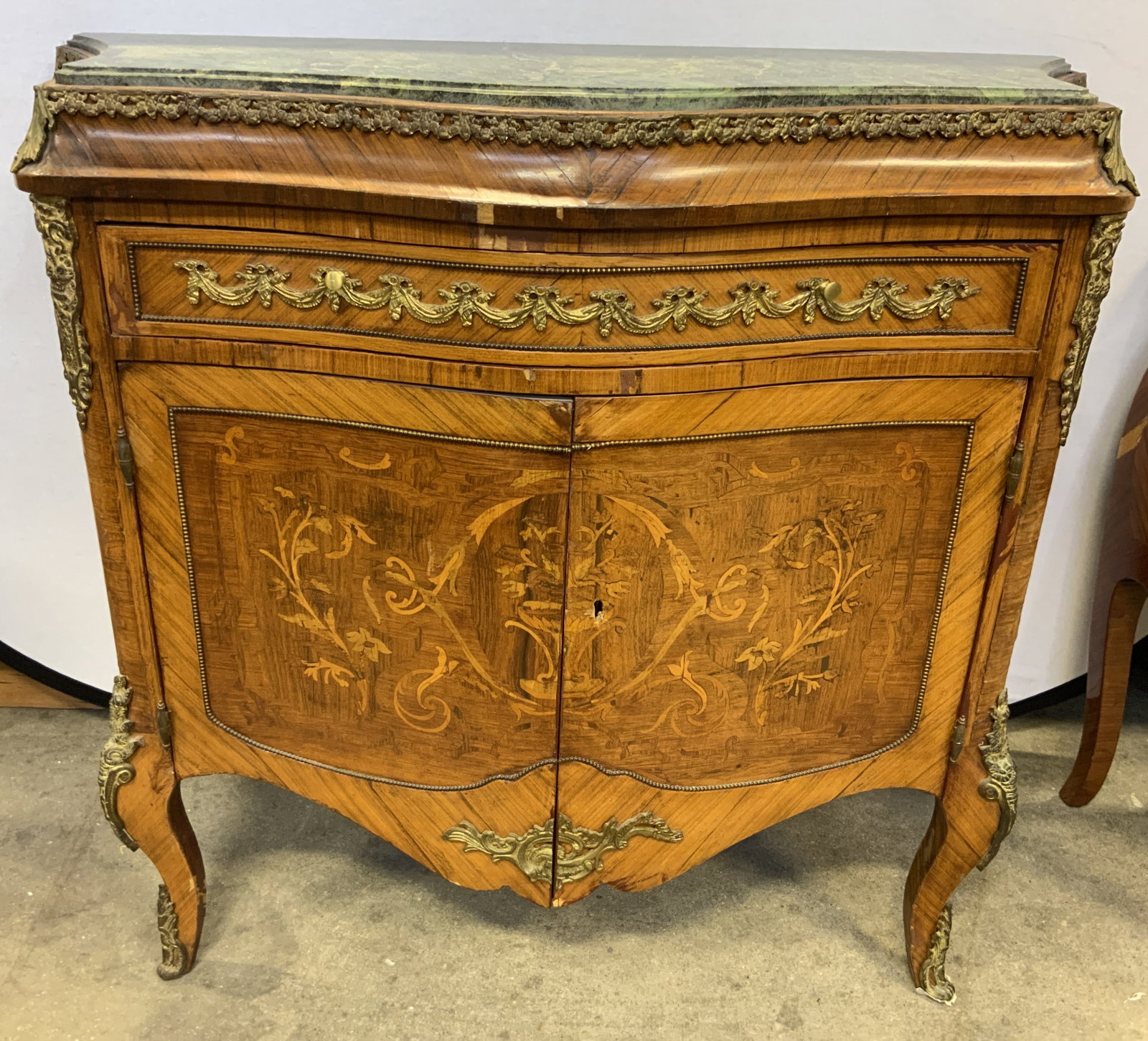 Antq Louis XV Marble Top Marquetry Cabinet: Marquetry cabinet appears to be antique. Possibly 19th Century French. Piece is tan toned and wooden with intricate marquetry parquetry wood inlay floral, scroll, leaf & vase detail. Piece has 1 drawe