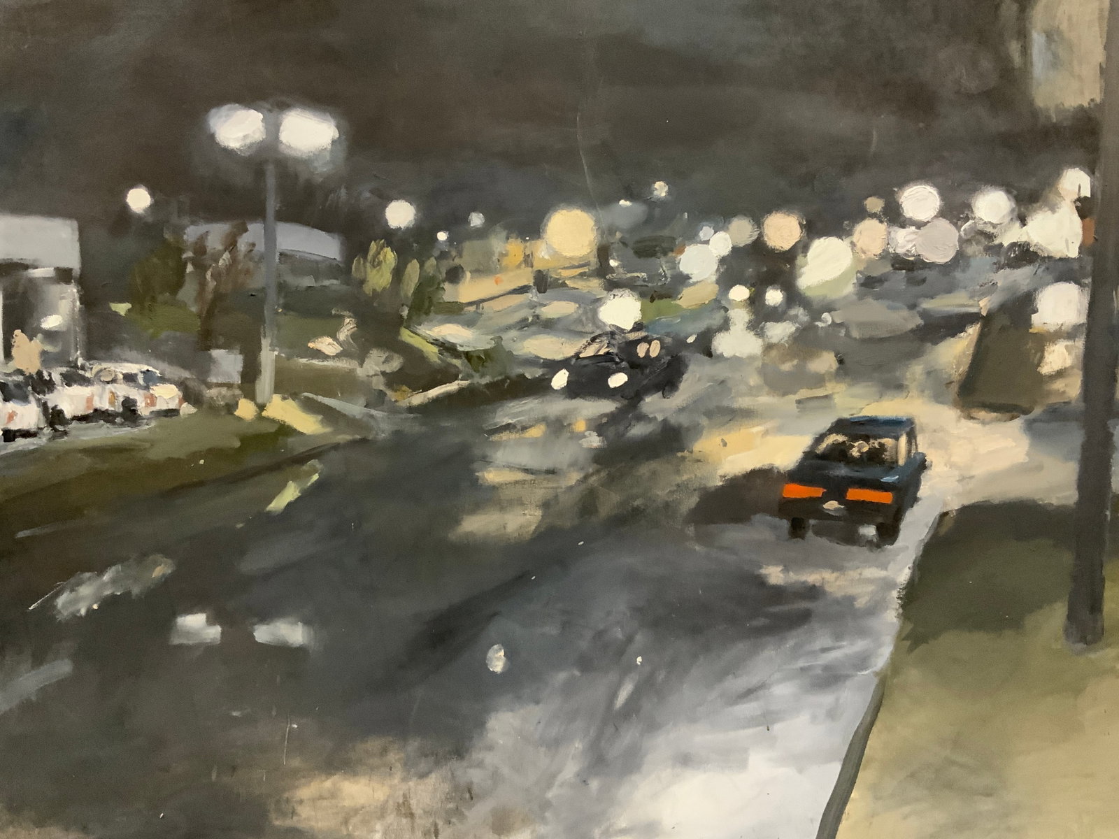 Tyler Larson Large Street at Night Oil Painting: Oil paint on canvas. Art by Tyler Larson. Signed in lower right corner. Dated 2002. Subject depicts a street with cars and street lights at night. Canvas is stretched onto internal frame. Canvas measu