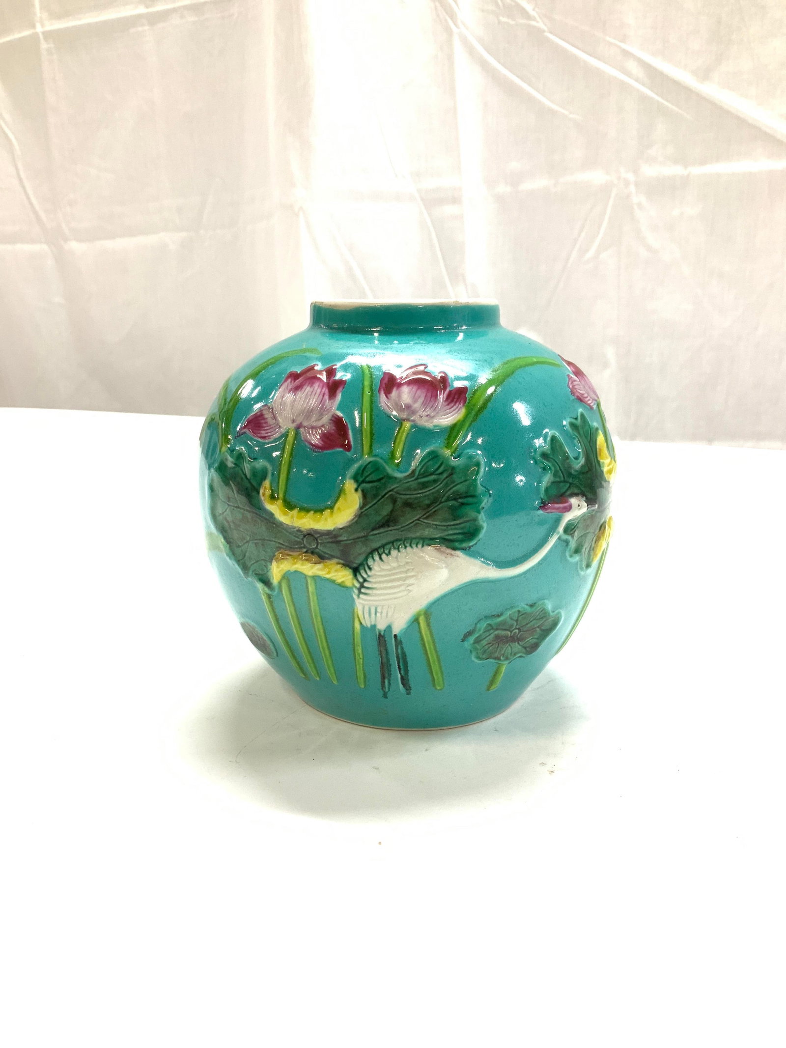Turquoise Asian Porcelain Vase w Crane: Hand painted Chinese vase with raised decor of a crane in high grasses and pink flowers on a turquoise background. Measures 5.5 in. Wide x 5.25 in. Ht. Asian vase, Asian crane porcelain vase, Asian Ci