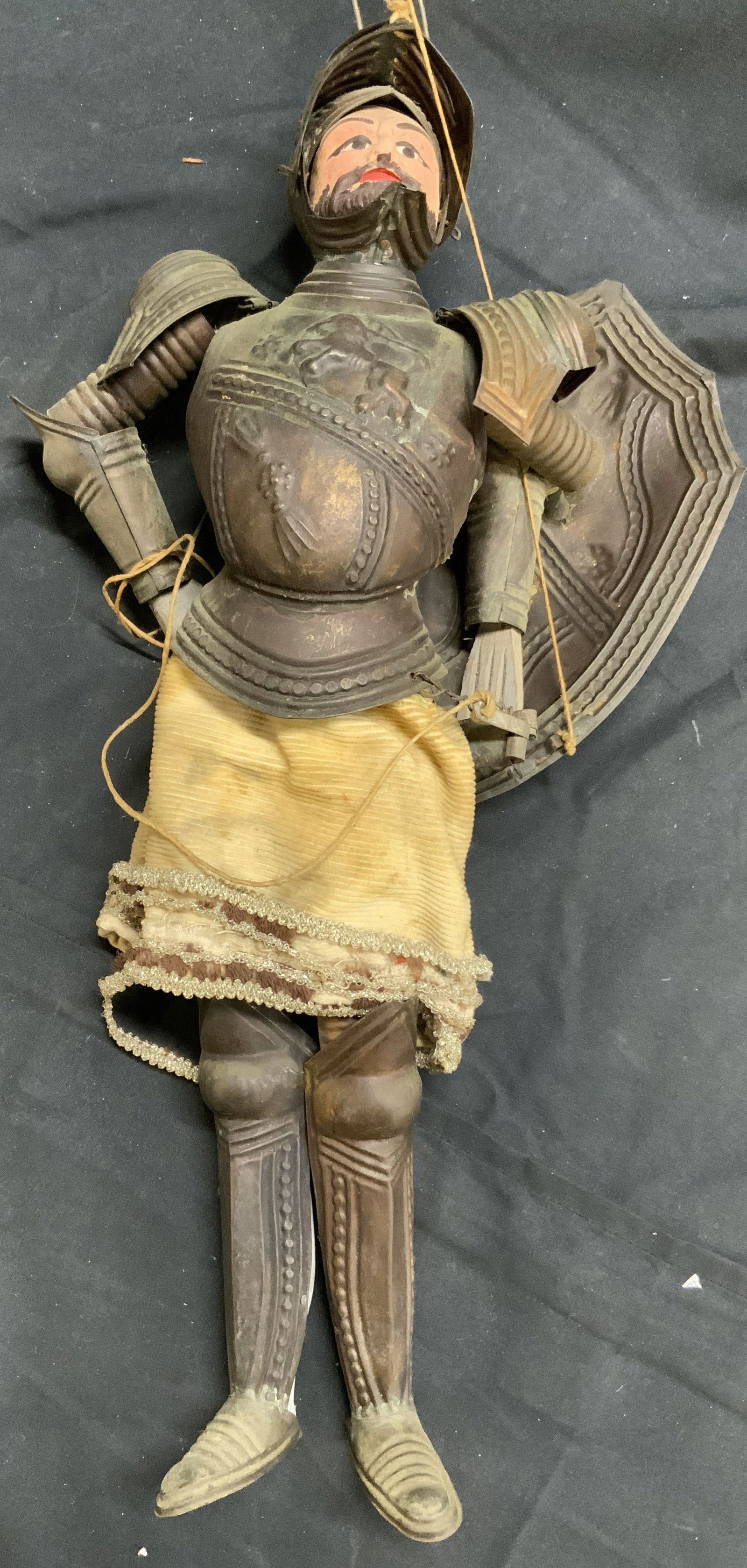 Antique Mid-19th Century Sicilian Marionette: Marionette is antique circa mid 19th century. Piece depicts a knight in armor. Marionette appears to be metal and wooden. Face appears to be handmade painted. Piece has metal hook to hang. Marionette