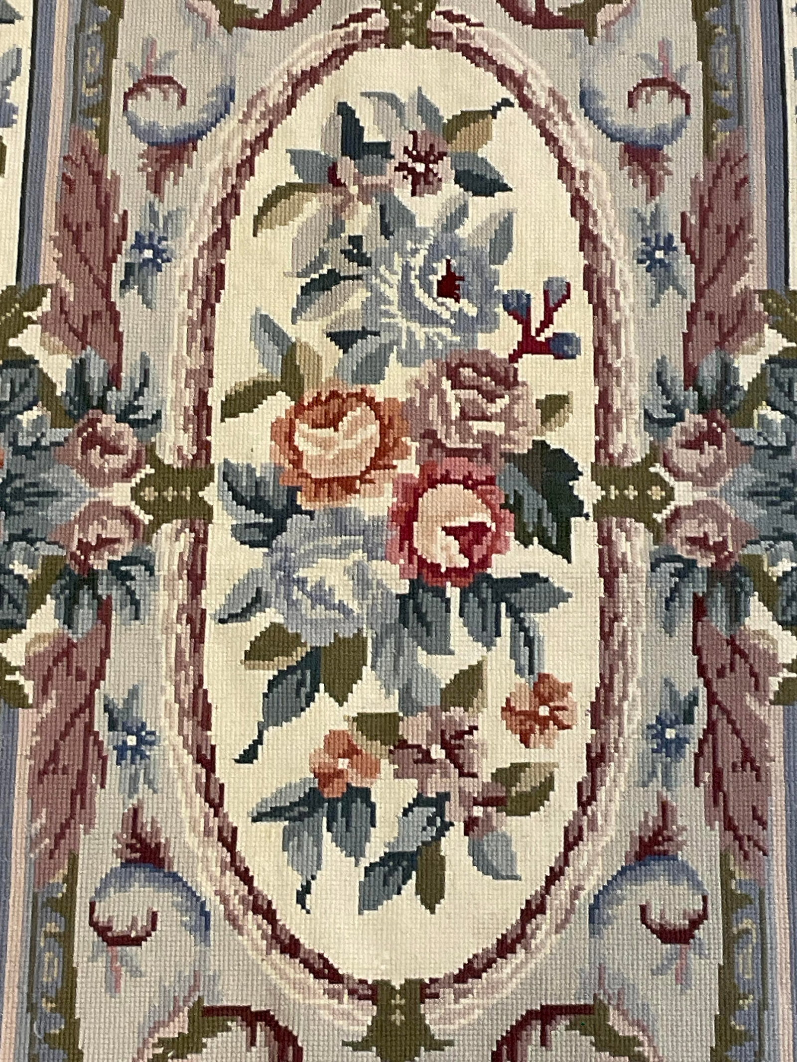 Vintage Floral Motif Runner Rug / Tapestry: A vintage floral motif runner rug / tapestry. Primarily pink, blue, green, and white hues. Measures approx. 23.5W x 59L in. Surface wear and discoloration present. Losses to material present. No mater