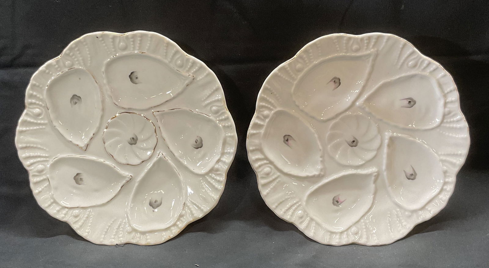 Lot 2 LS & S/Marx Gutherz Oyster Plates, Austria: Lot of 2 plates. LS and S and Marx Gutherz porcelain oyster plates. Plates are made from the same mold. Hand painted with raised shell motif with gilt decoration. Wells for five oysters on each plate.