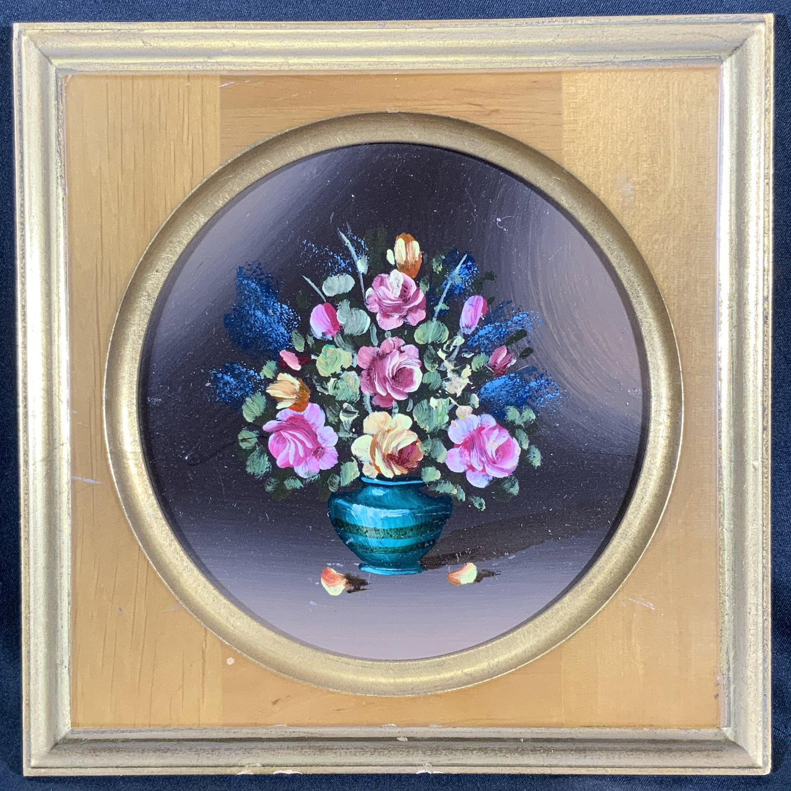 Miniature Still Life Wild Rose Bouquet Oil Painting: Oil painting on panel board. Subject depicts a still life of a wild rose bouquet with foliage and other wild flowers. Framed in a gilt wooden frame with a circular window. Frame measures approx. 7 W x