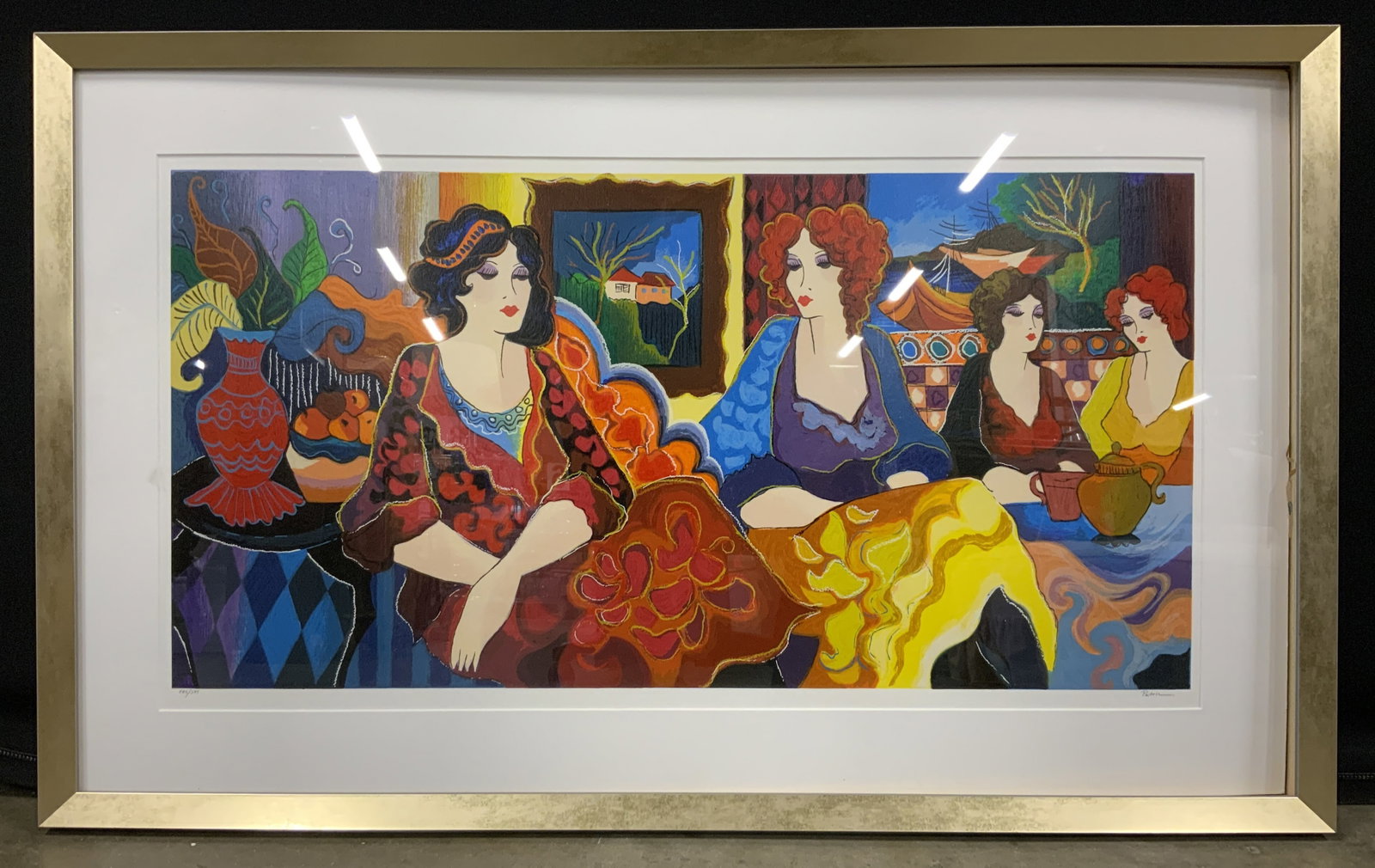 Patricia Govezensky Cafe Laguna Serigraph: Serigraph on paper. Art by Patricia Govezensky. Signed in lower right corner. Titled Cafe Laguna. Limited edition number 175/375. Subject depicts woman lounging in a cafe in colorful clothing by a Lag