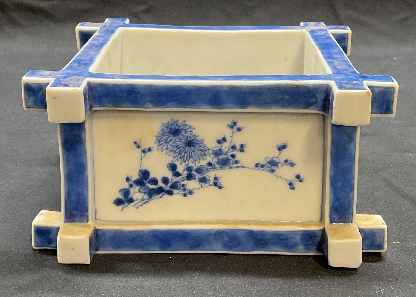 Blue & White Porcelain Koi Bonsai Planter: Asian porcelain bonsai planter. Hand painted blue and white with floral, bamboo, and koi fish motif. Square shaped. Piece has weight. Measures approx. 6 x 6 x 3 inches. Some surface wear including scr