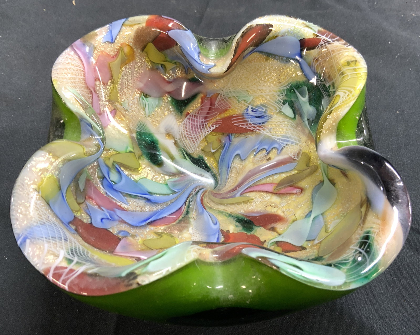 MURANO Art Glass Trinket Dish Bowl Vessel: Vessel appears to be MURANO glass (no apparent markings). Piece has intricately detailed multi toned interior & green toned exterior. Vessel has areas which curl inward to give structure a floral form